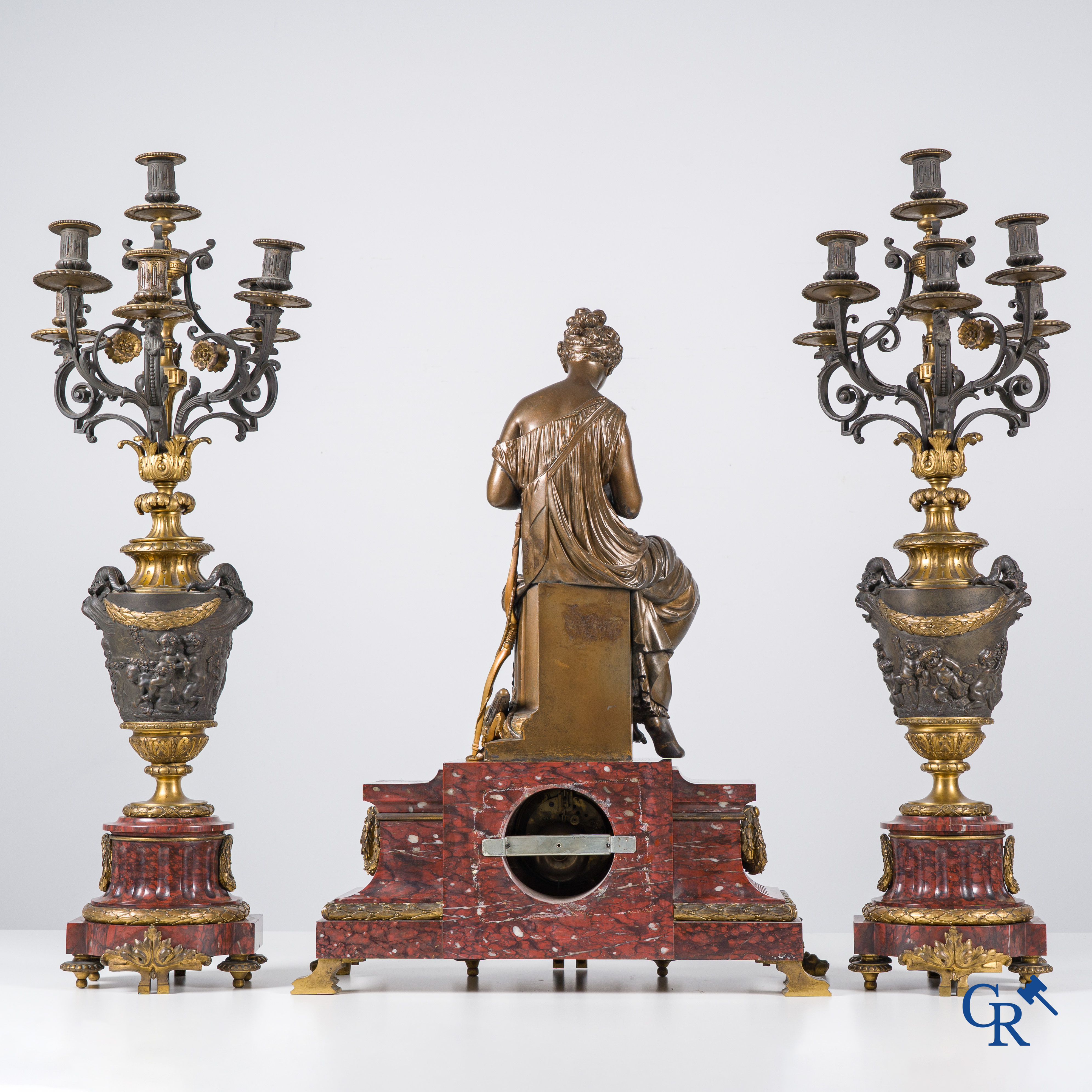 Charpentier à Paris, An imposing 3-piece fireplace clockset in gilded and patinated bronze. Late 19th century.