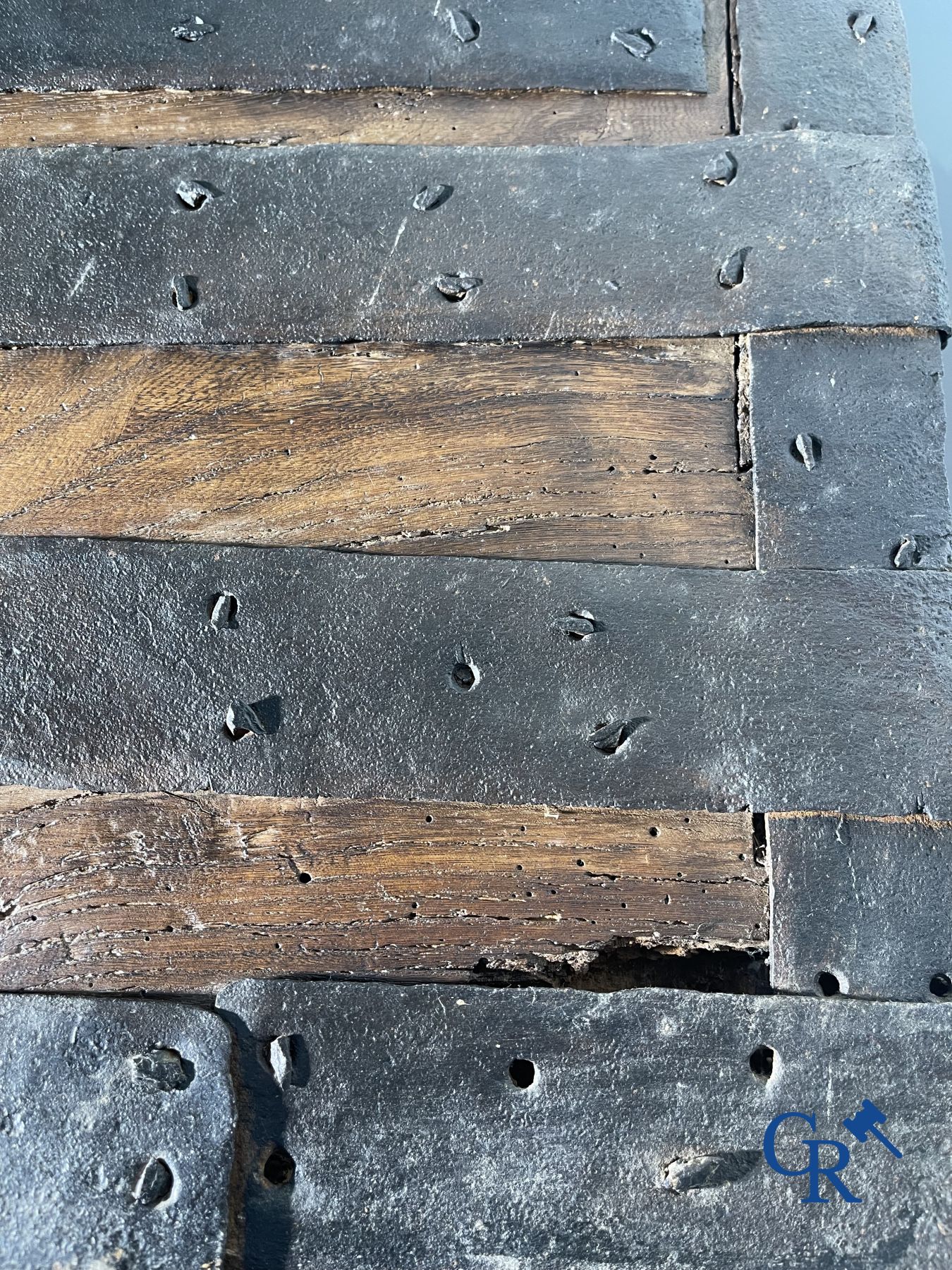 Antique wooden chest with hardware and lockwork in forging.