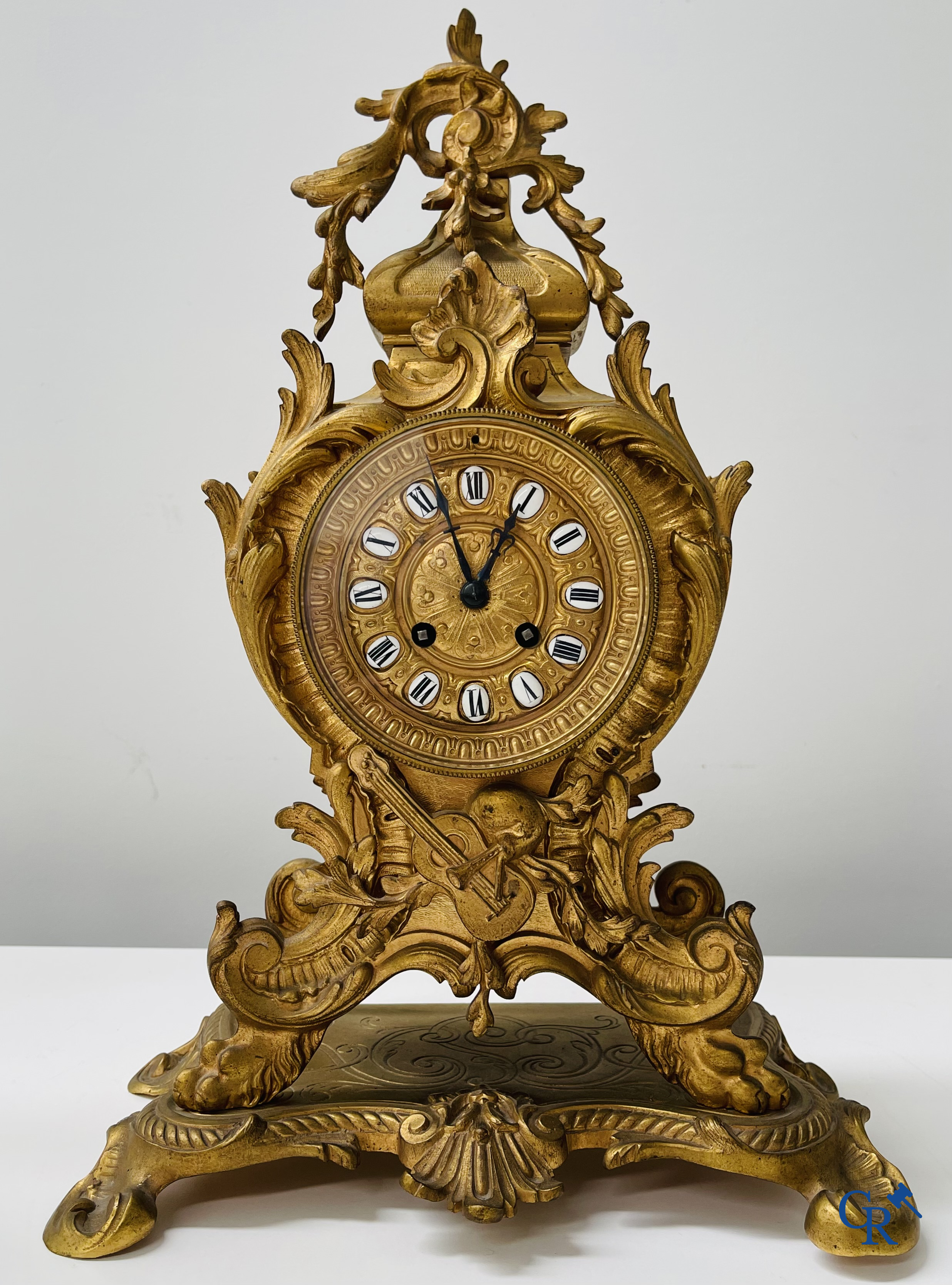 3-piece clock set in gilded bronze. Bronze dial with enamelled Roman numerals. LXV style. Period 1900.