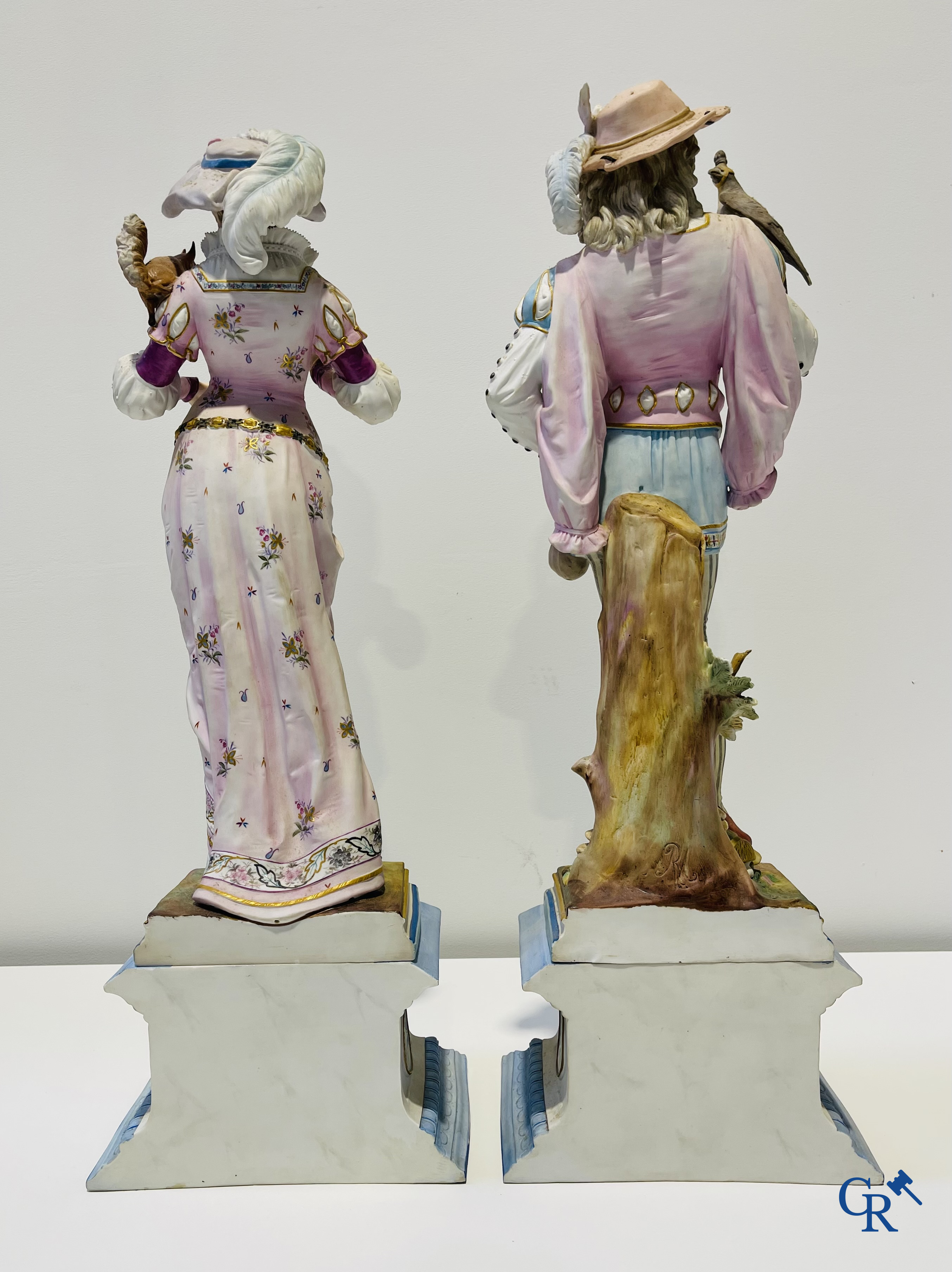 Exceptional pair of large statues in coloured and gilded biscuit porcelain. 2nd half of the 19th century.