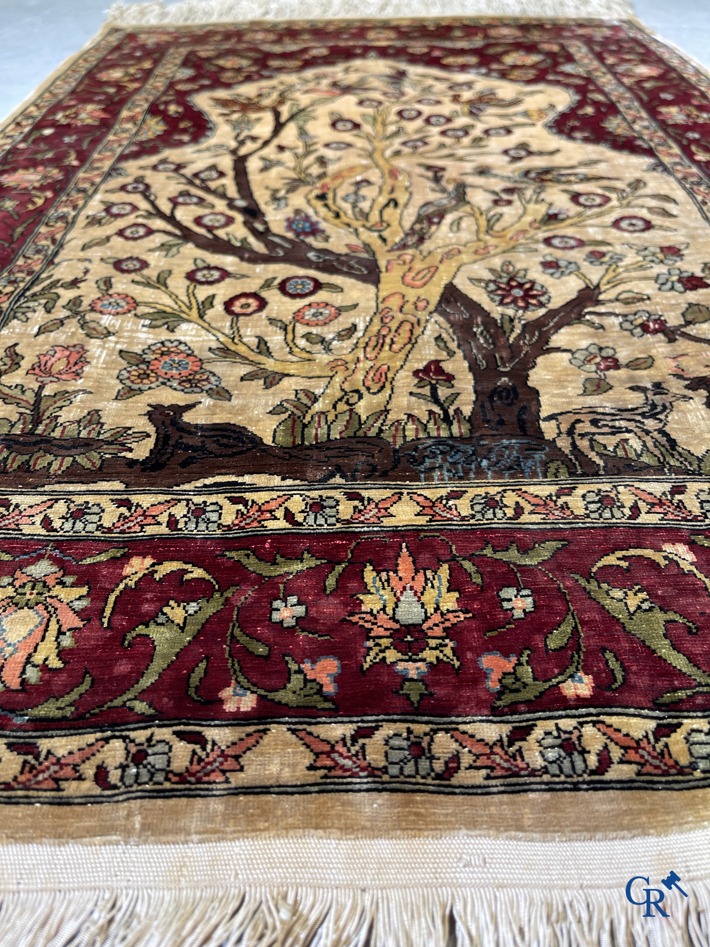 Oriental carpets, Hereke, a finely hand-knotted and signed silk carpet with a tree of life.