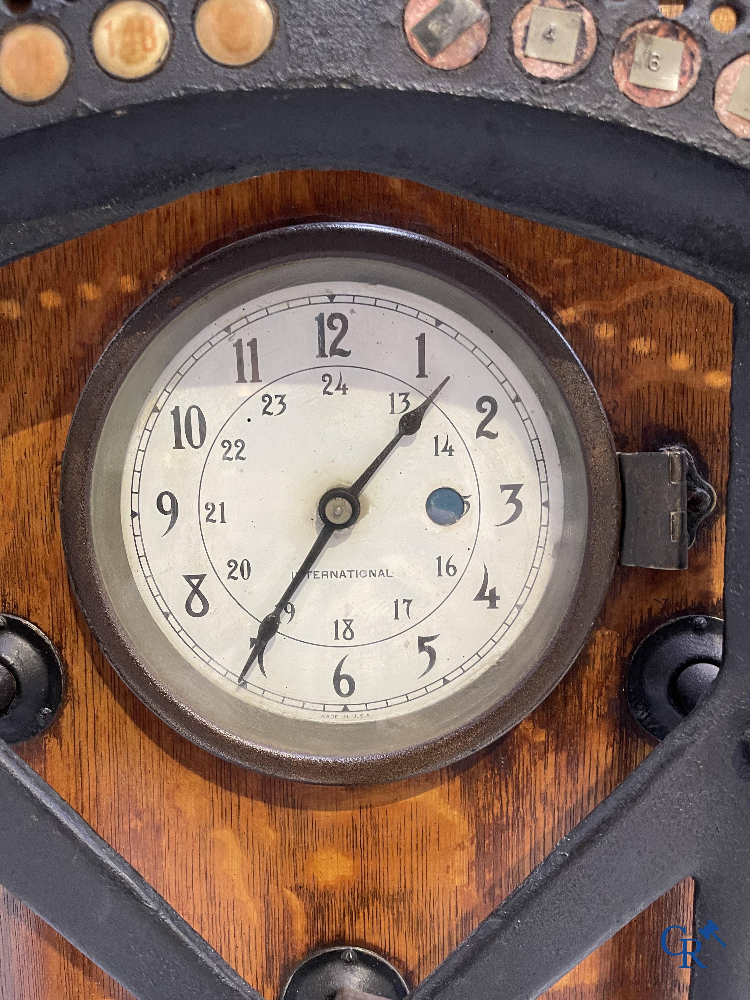 "International" Watson Business Machines Corporation of Belgium. A time clock with cast iron wheel. Circa 1900.