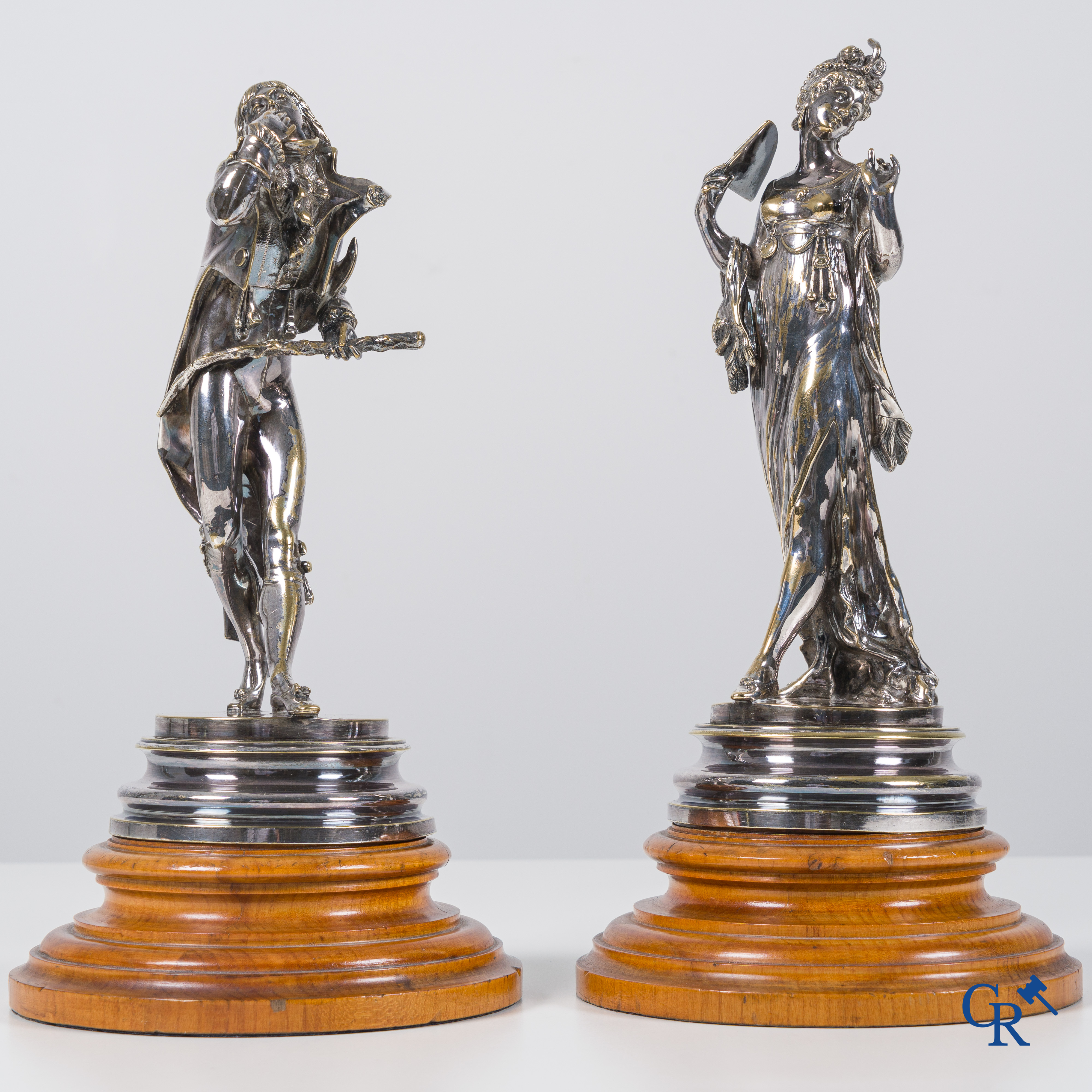 Auguste Lalouette (1826-1883) Les Incroyables/Merveilleuses. Une paire de statues en bronze argenté.