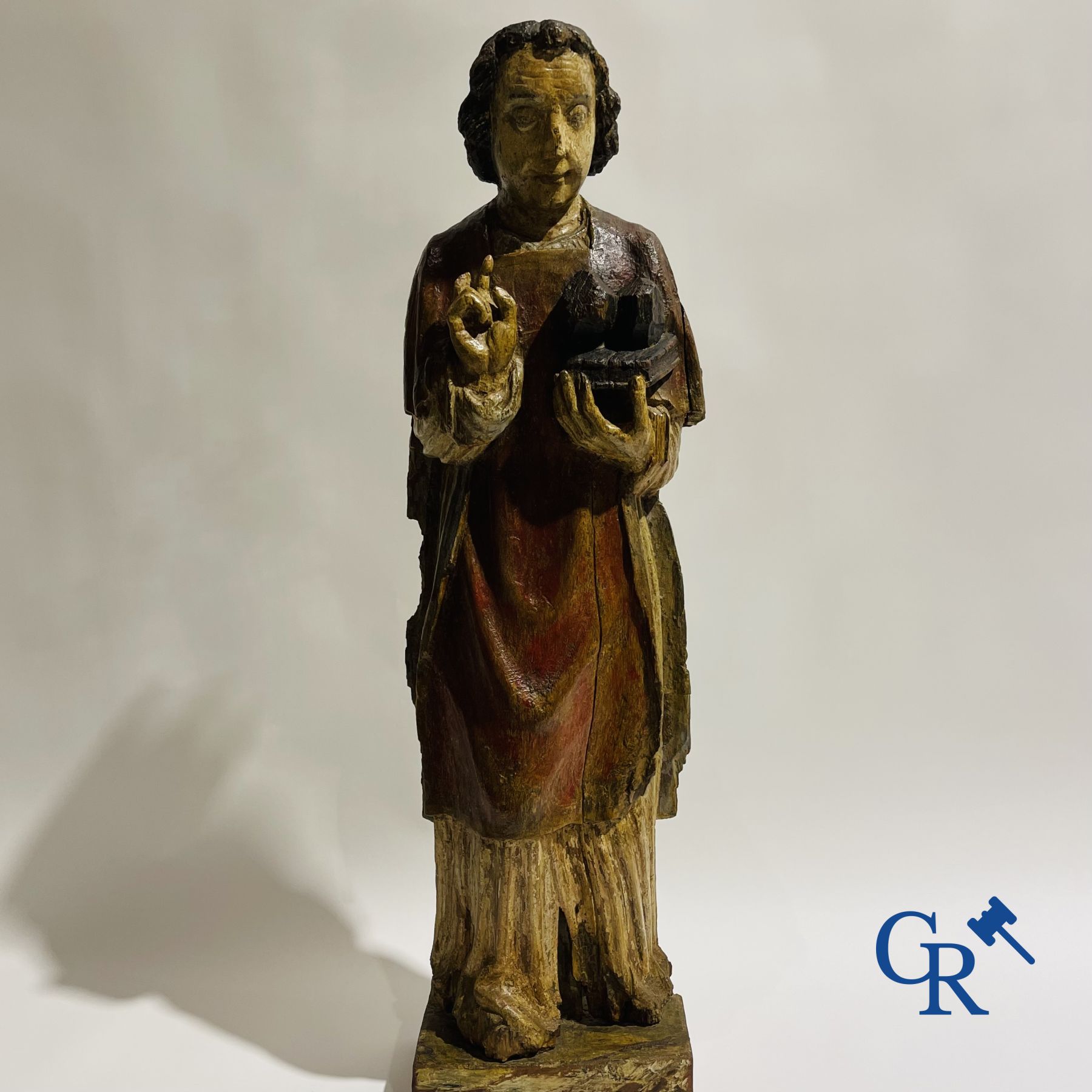 Wooden sculpture: Polychrome wood sculpture of a saint. Saint Stephen. Probably 17th century.