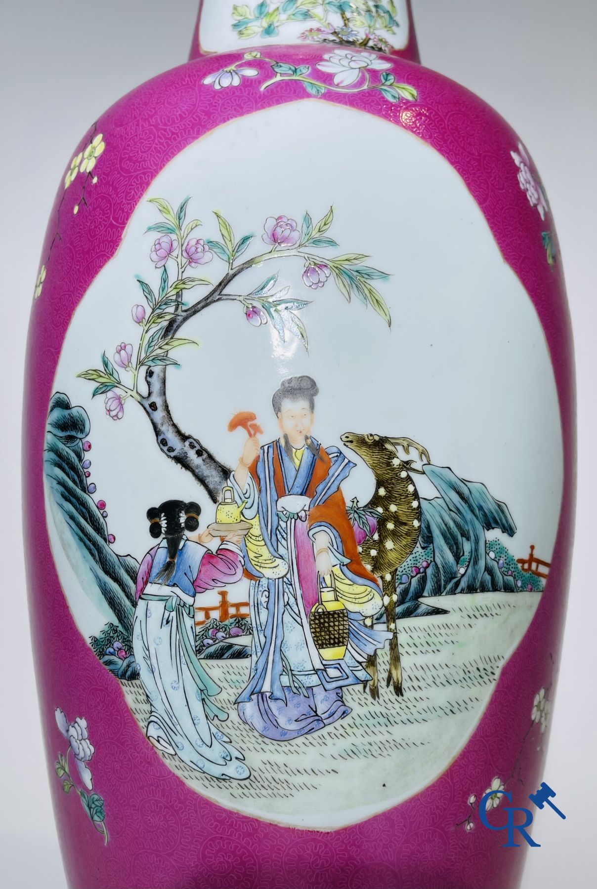 Chinese porcelain: A fine famille rose vase decorated on a red ruby background in sgraffito technique.