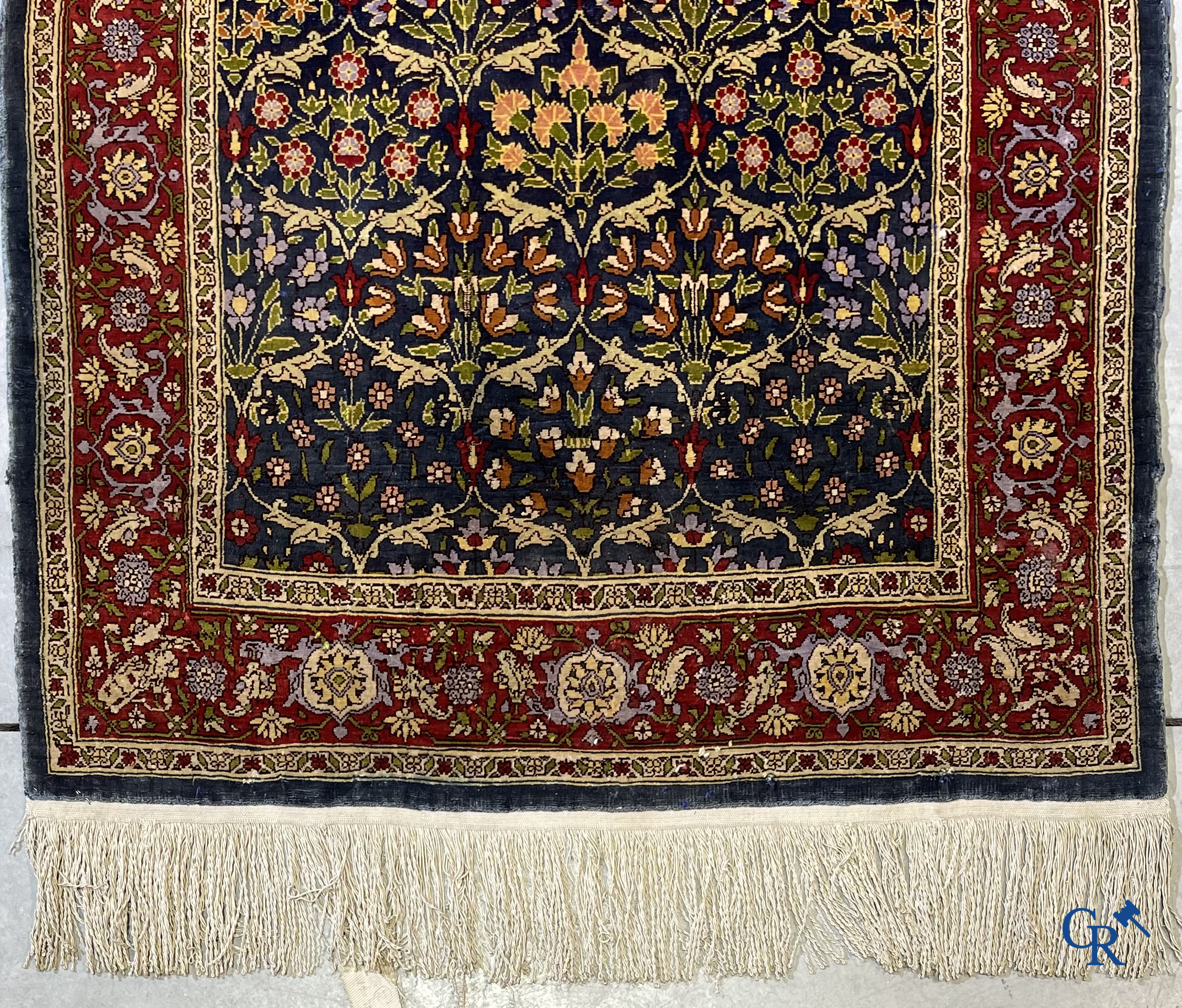 Oriental carpets, a finely hand-knotted silk carpet with floral decor.