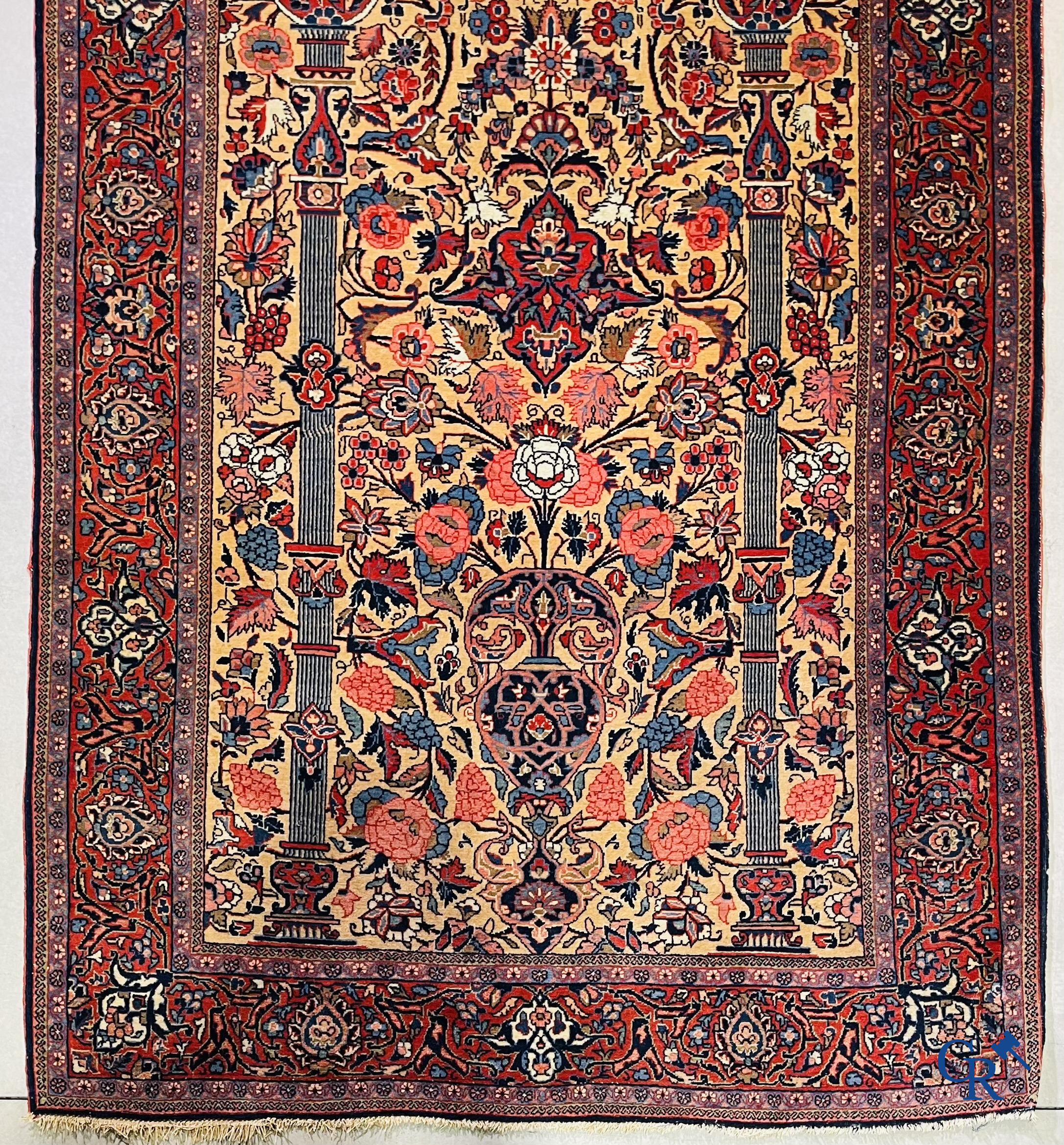 Oriental carpets: Iran. 2 antique hand-knotted Persian carpets with floral decor.