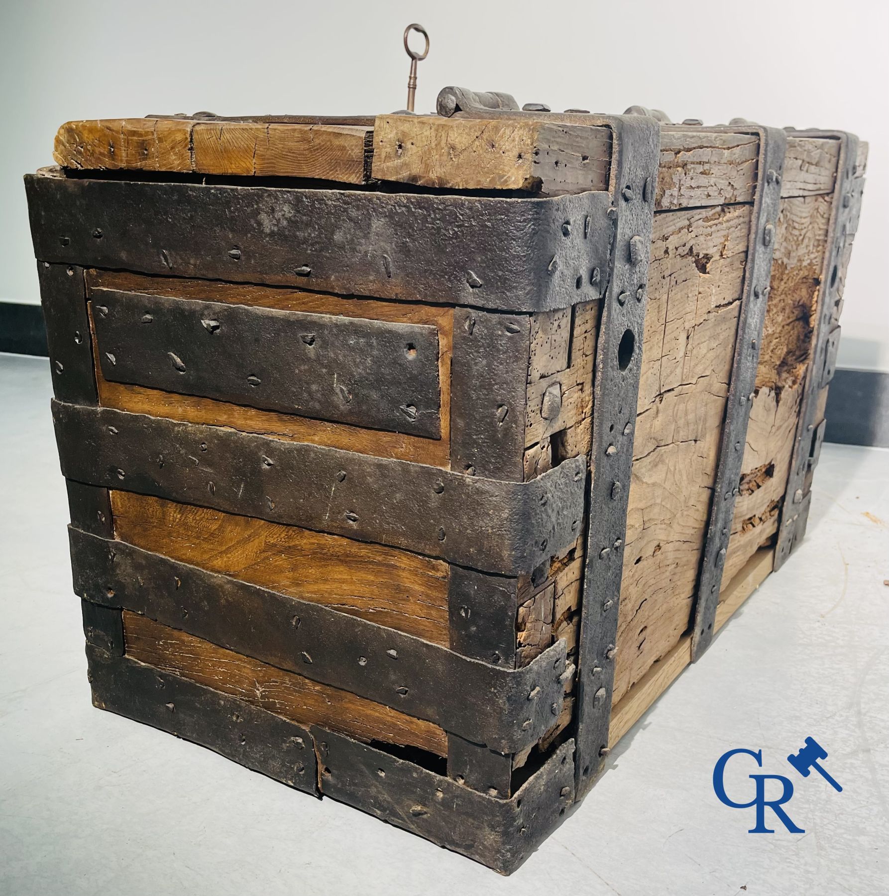 Antique wooden chest with hardware and lockwork in forging.