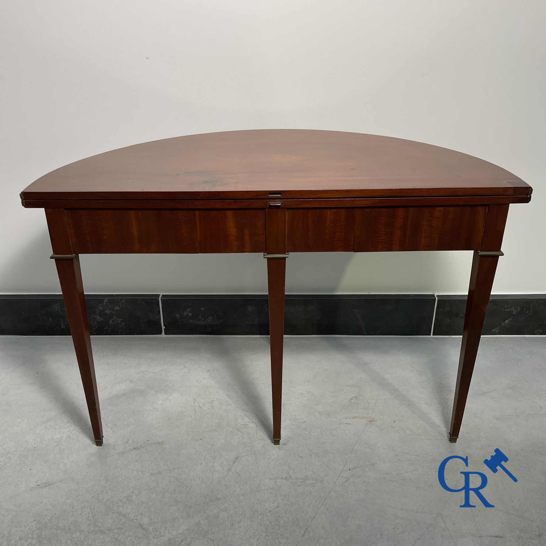 Furniture: fold-out crescent-shaped mahogany table. Directoire period.