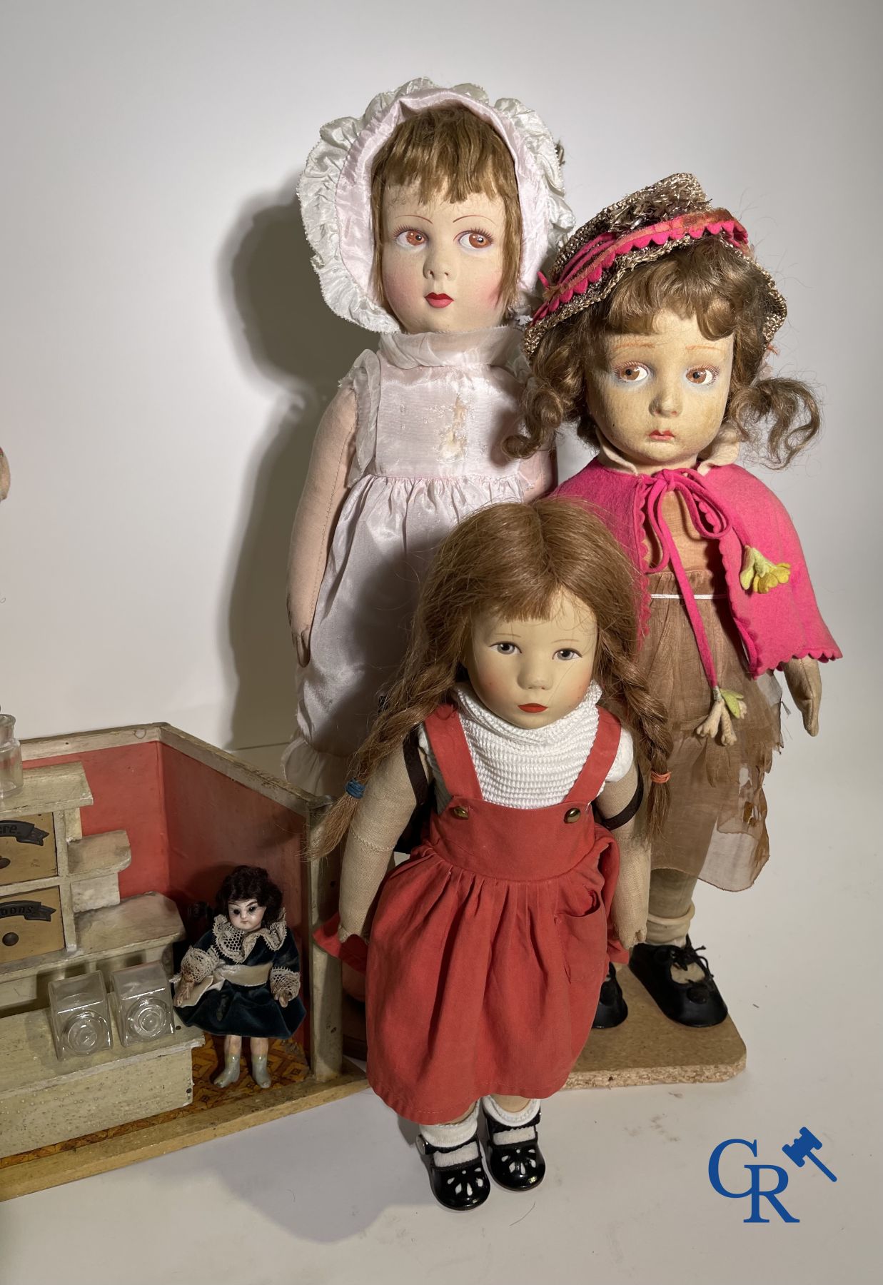 Toys: antique dolls: a lot of 6 dolls with a miniature grocery store attached.