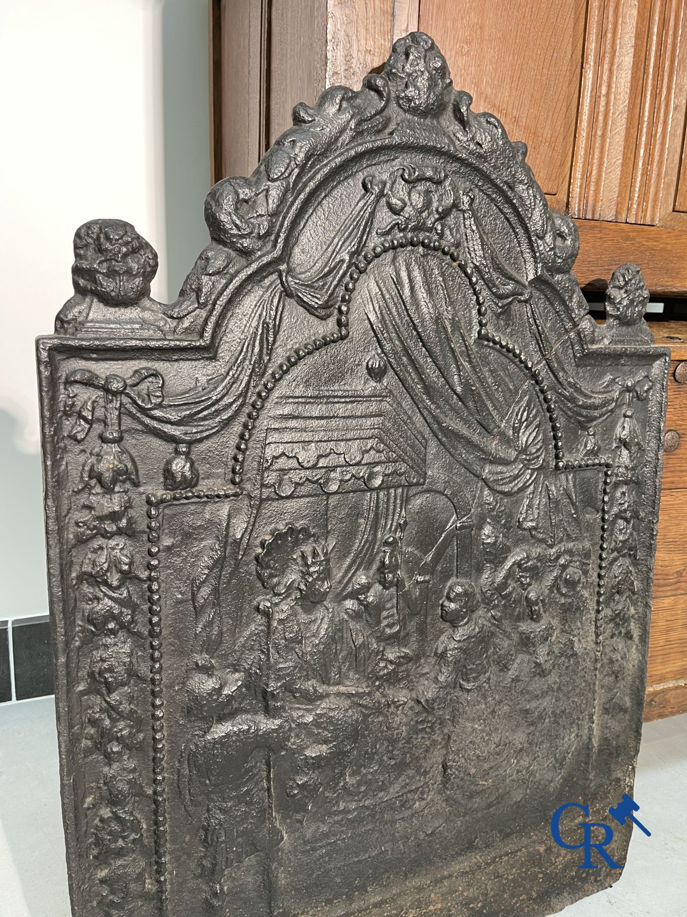 2 oak chests and an antique cast iron fireplace plate.