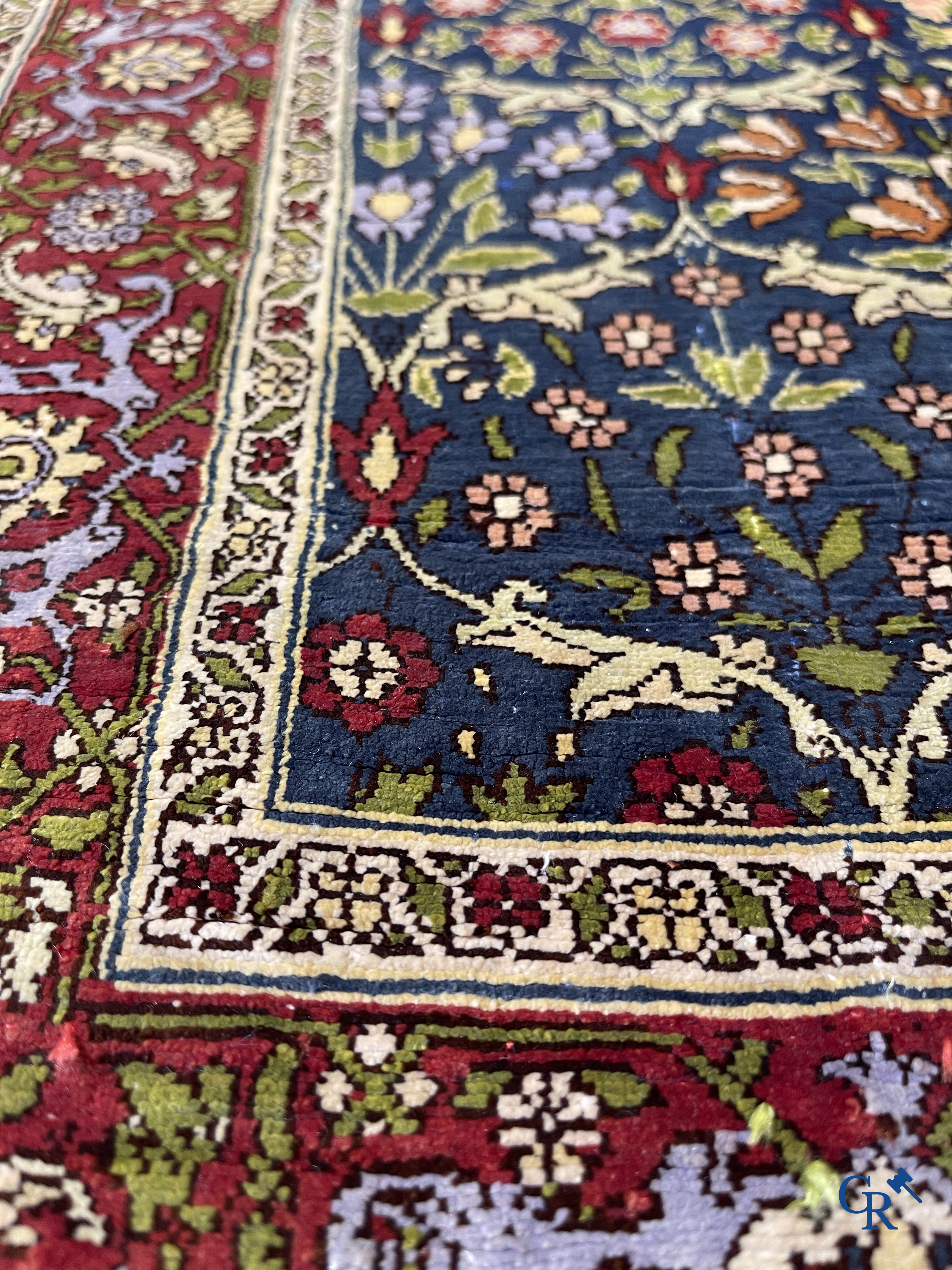 Oriental carpets, a finely hand-knotted silk carpet with floral decor.