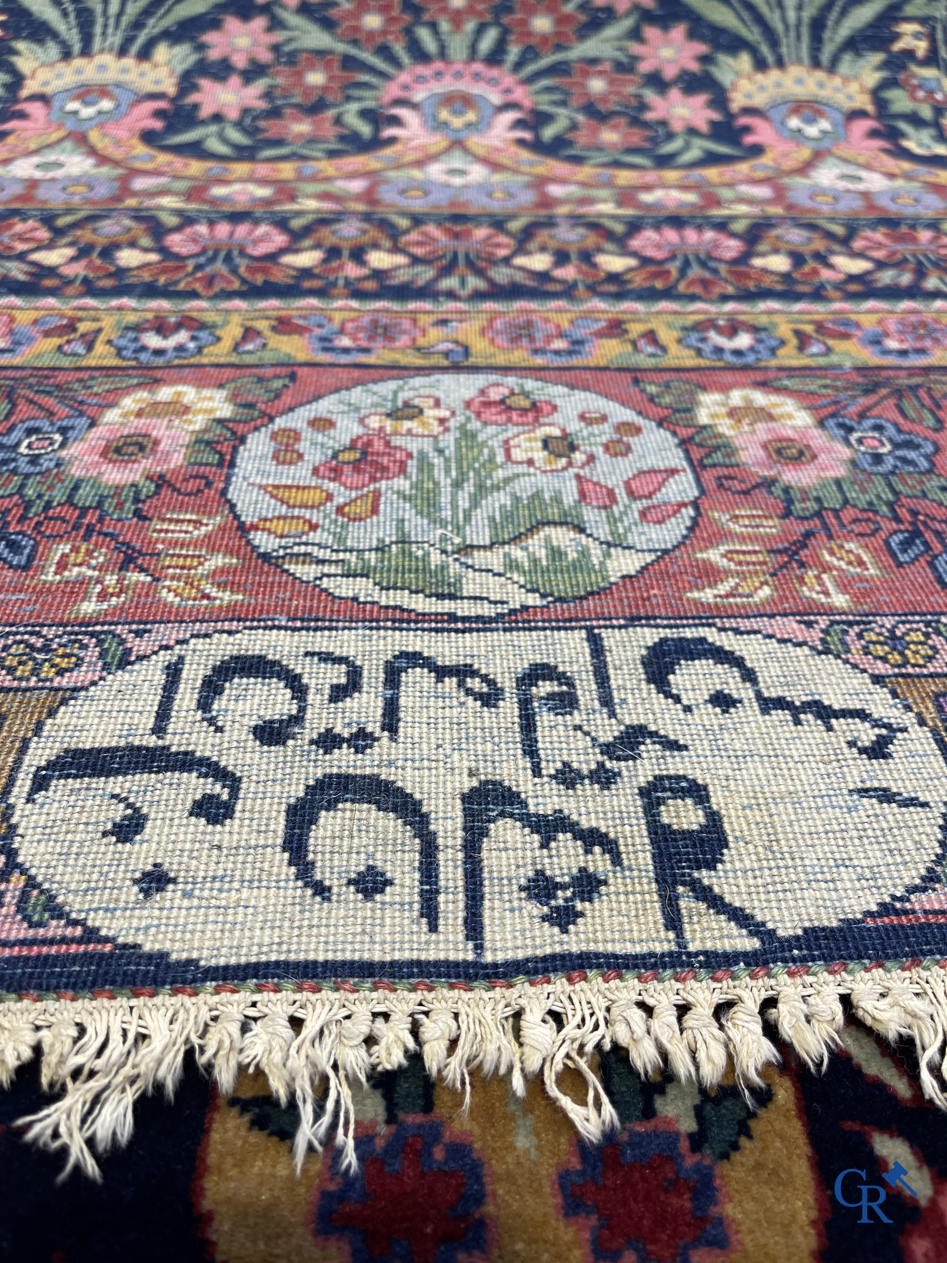 Oriental carpets: A finely knotted Oriental carpet with floral decor. Signed.