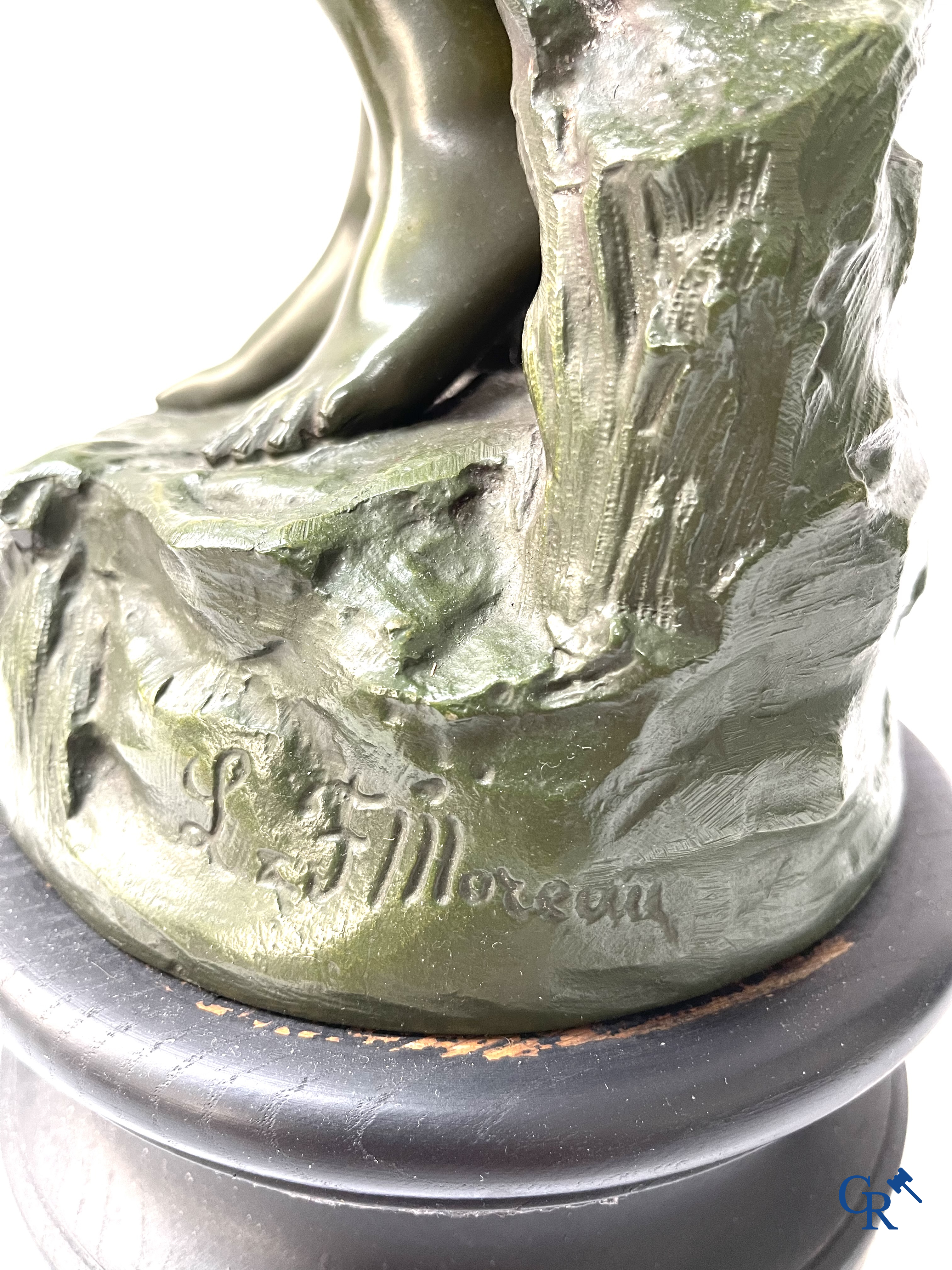 Louis & François Moreau, A large pair of statues in green patinated spelter on a wooden base. Signed L&F Moreau.