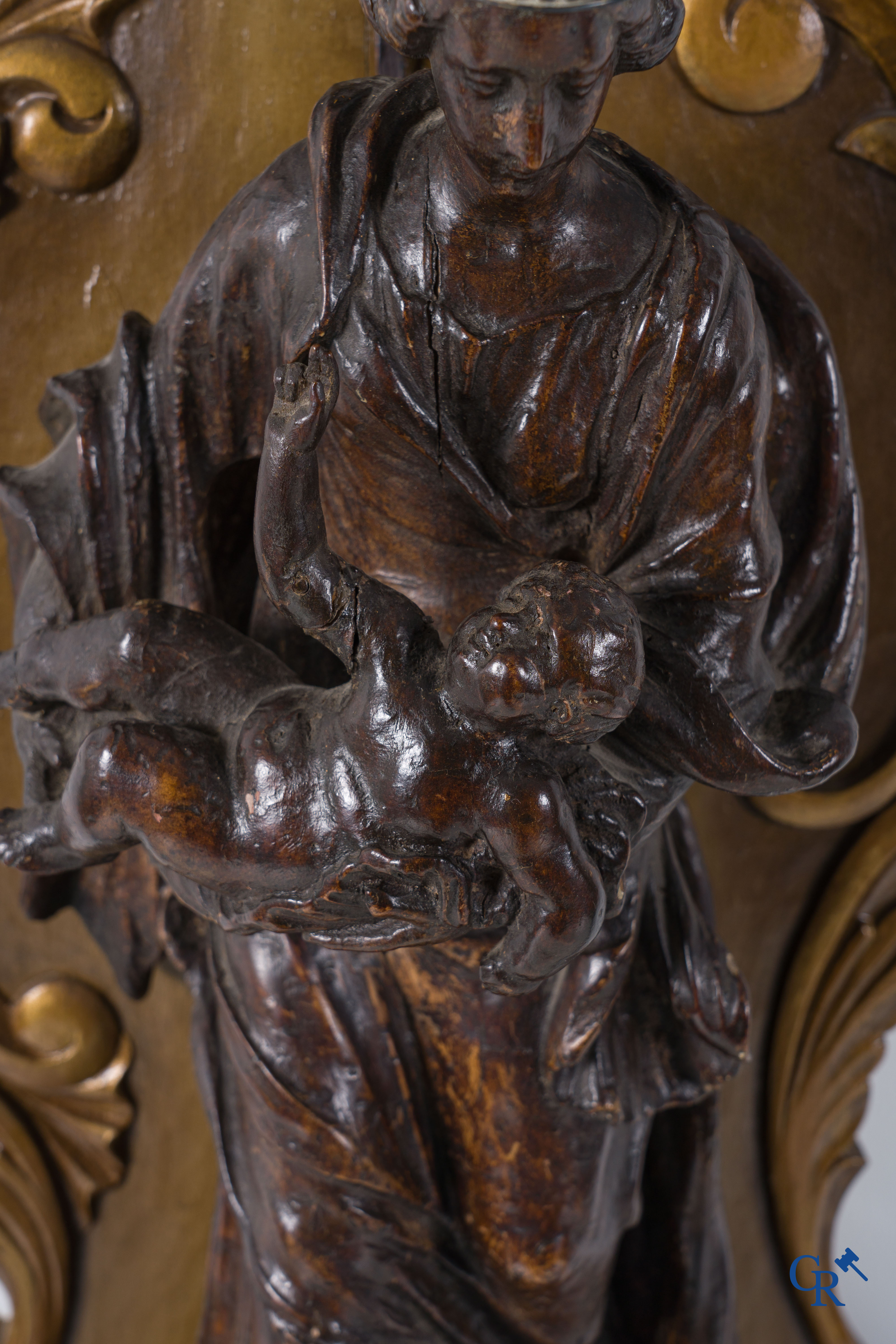 Imposing wooden sculpture of Mary with child, richly sculpted with angels and a dragon. 17th-18th century.