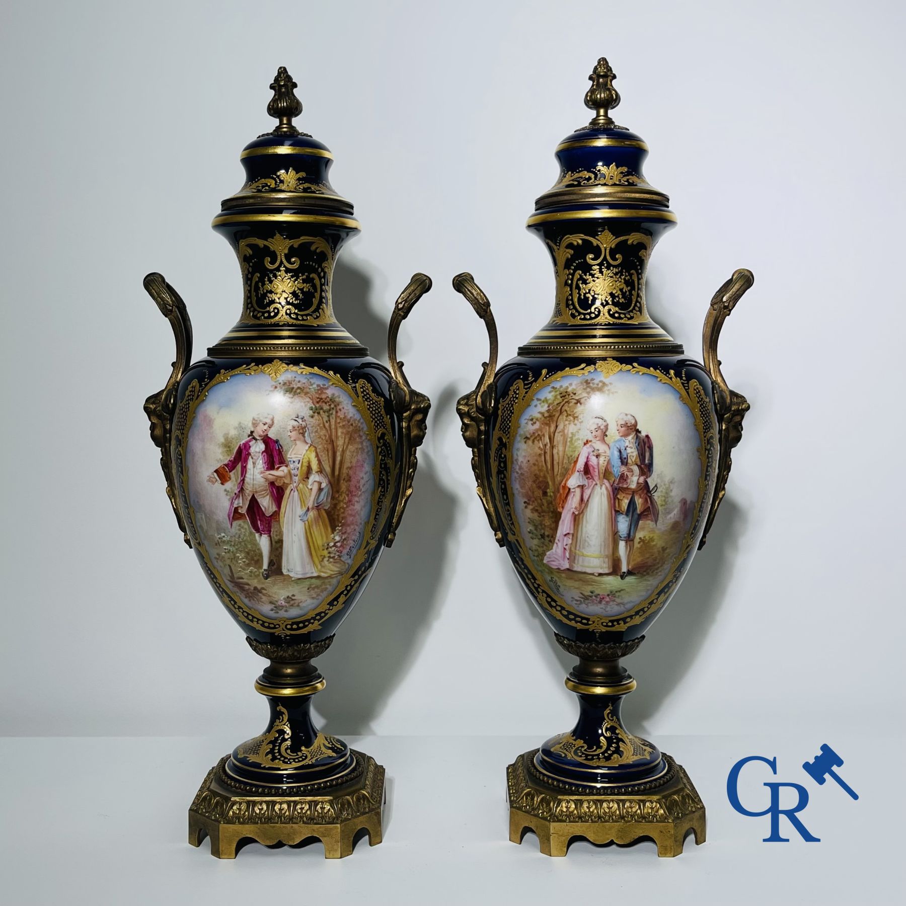 Porcelain: Sèvres: Pair of bronze mounted vases in Sèvres porcelain..