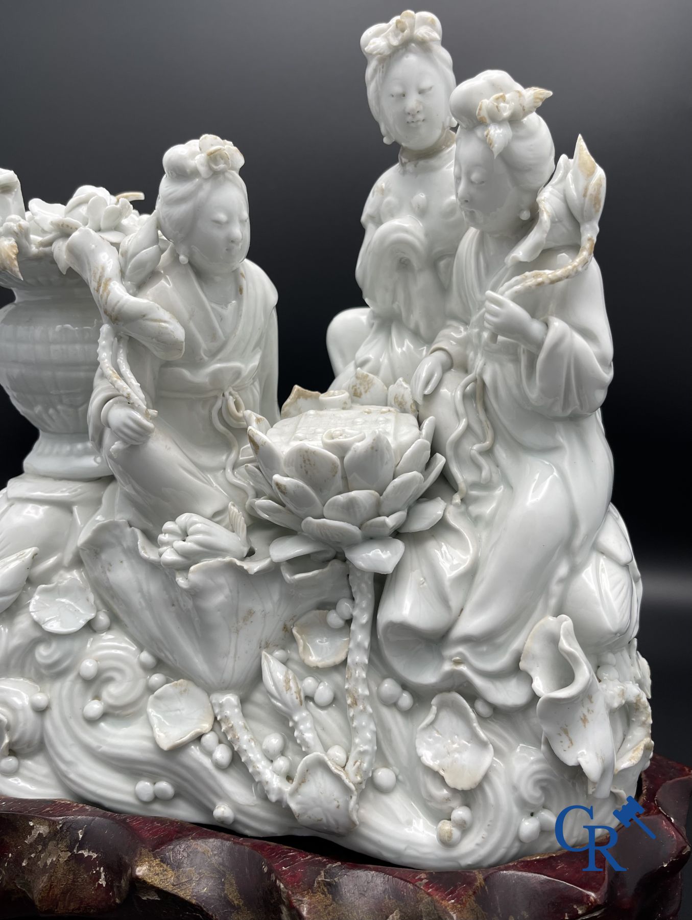 Chinese porcelain: A Buddhist lion and a group in blanc de Chine.