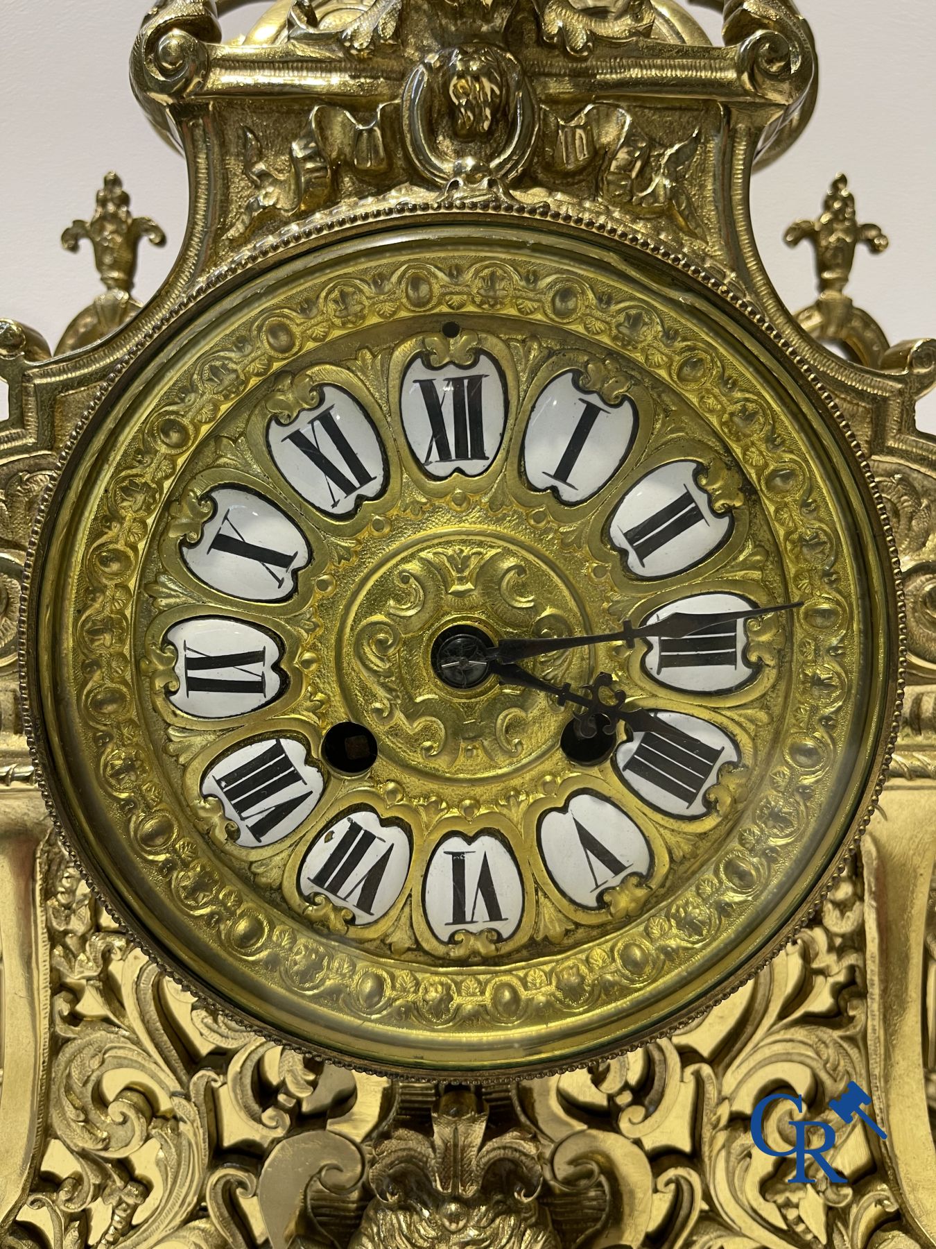 A three-part bronze fireplace clockset in Renaissance style and 2 painted tin and bronze pendant clocks.