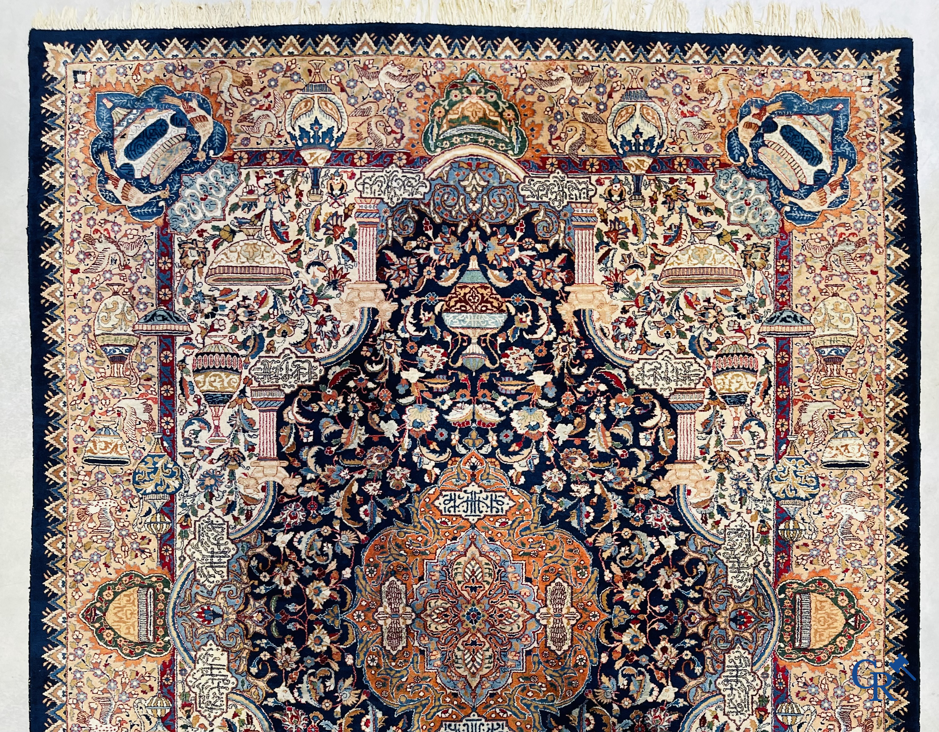 Oriental carpets: A large hand-knotted oriental carpet with antique decor. Multiple inscriptions.