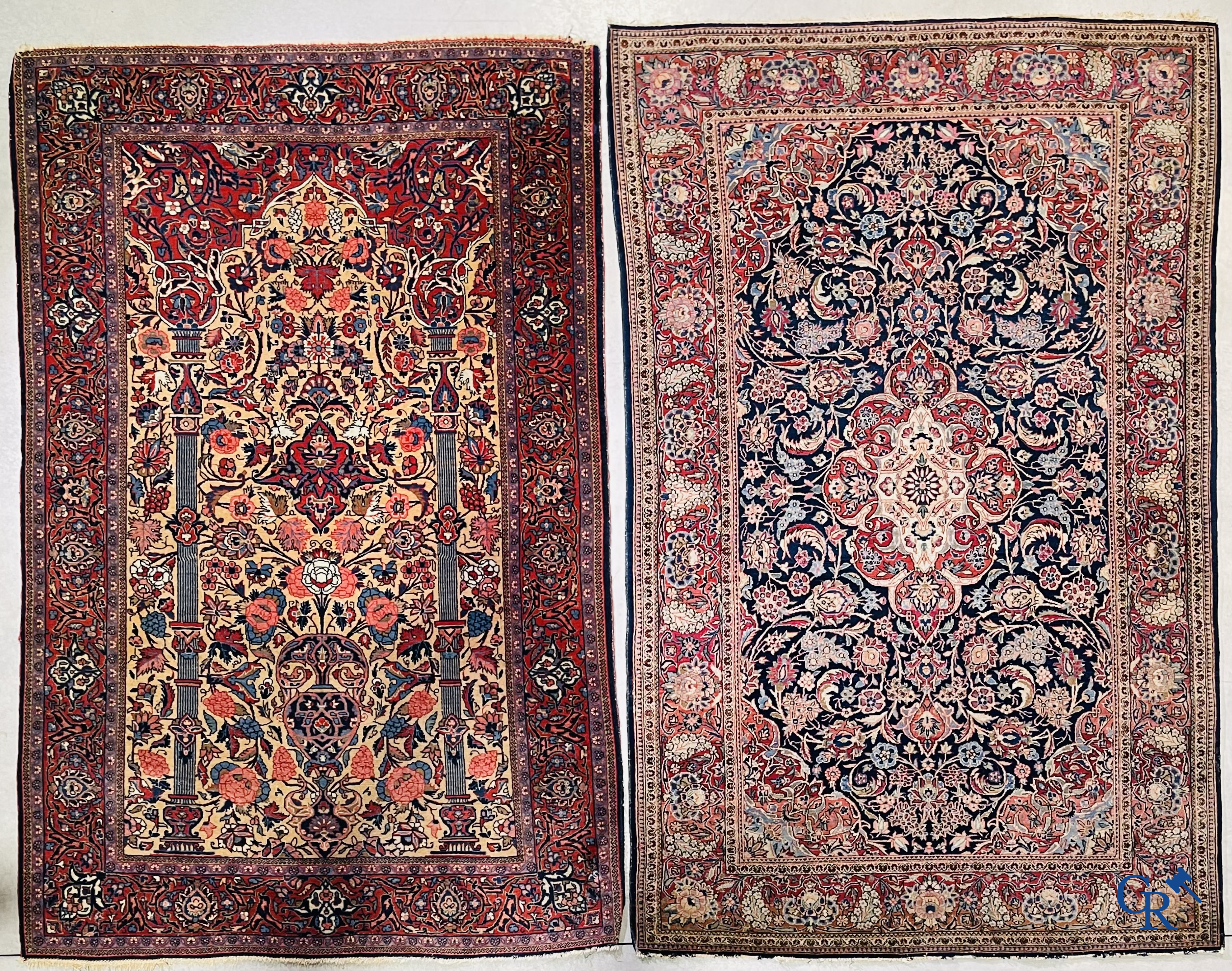 Oriental carpets: Iran. 2 antique hand-knotted Persian carpets with floral decor.