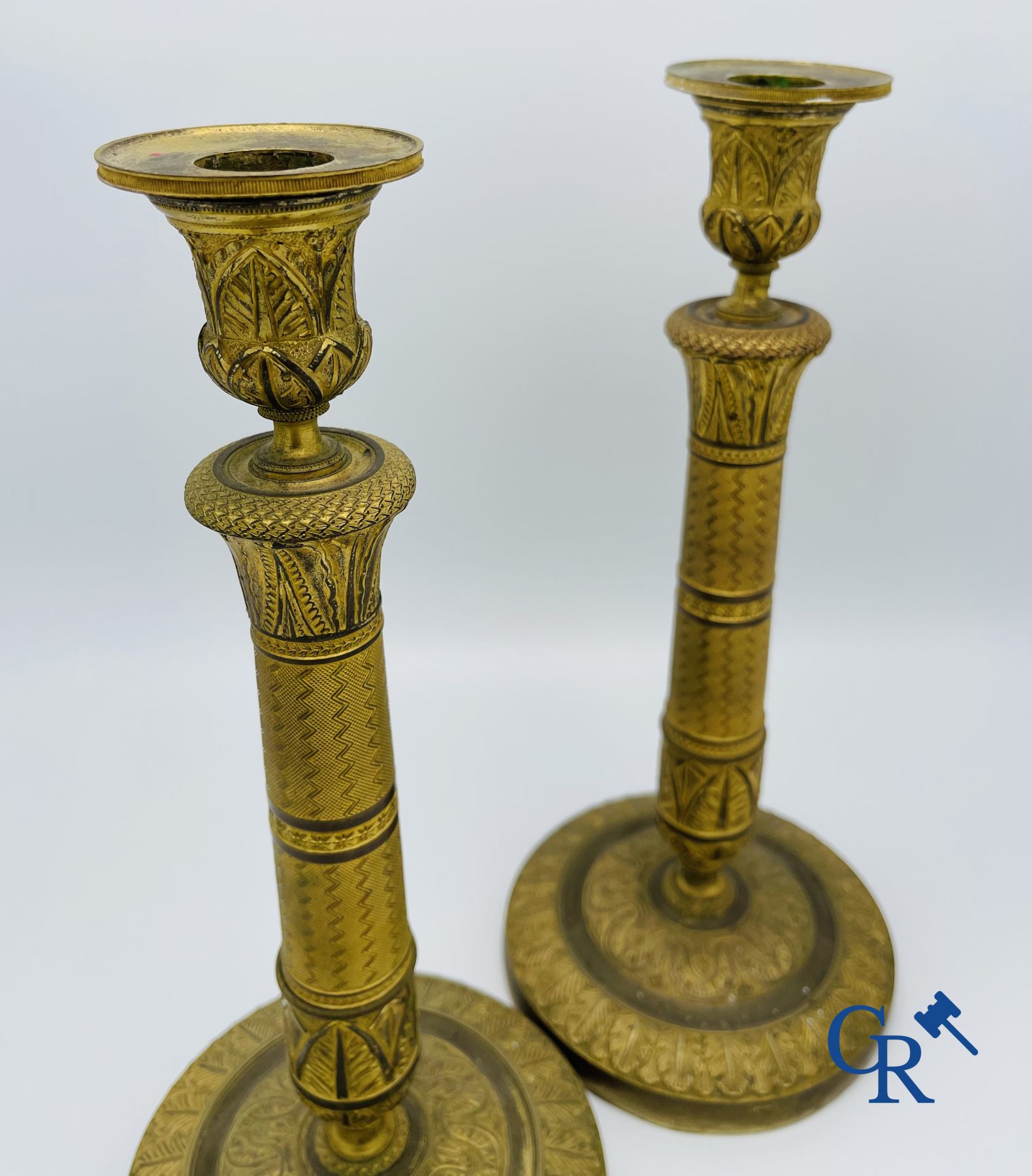 Pair of Charles X candlesticks in gilded bronze.