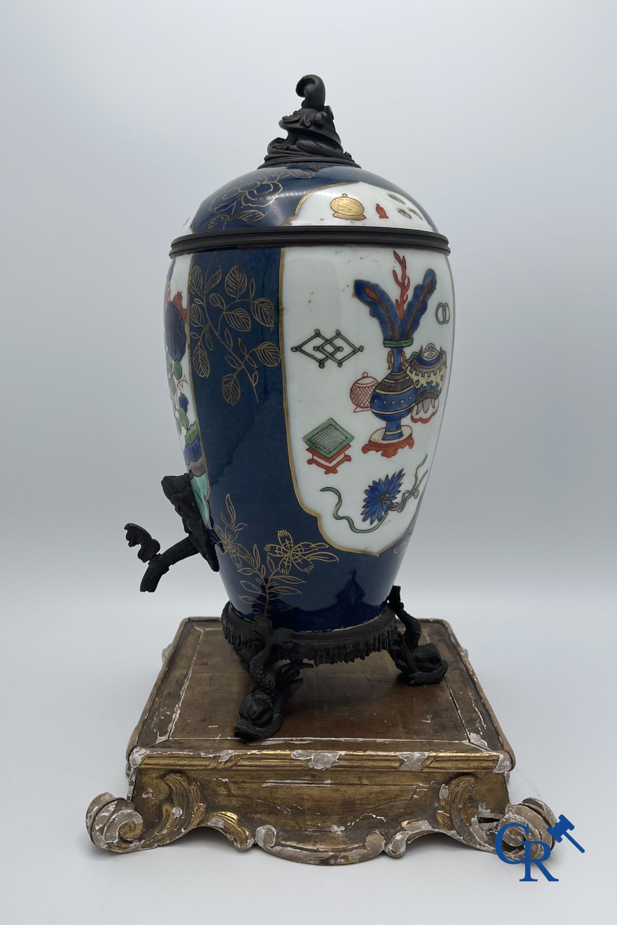 A porcelain table fountain with bronze fittings.