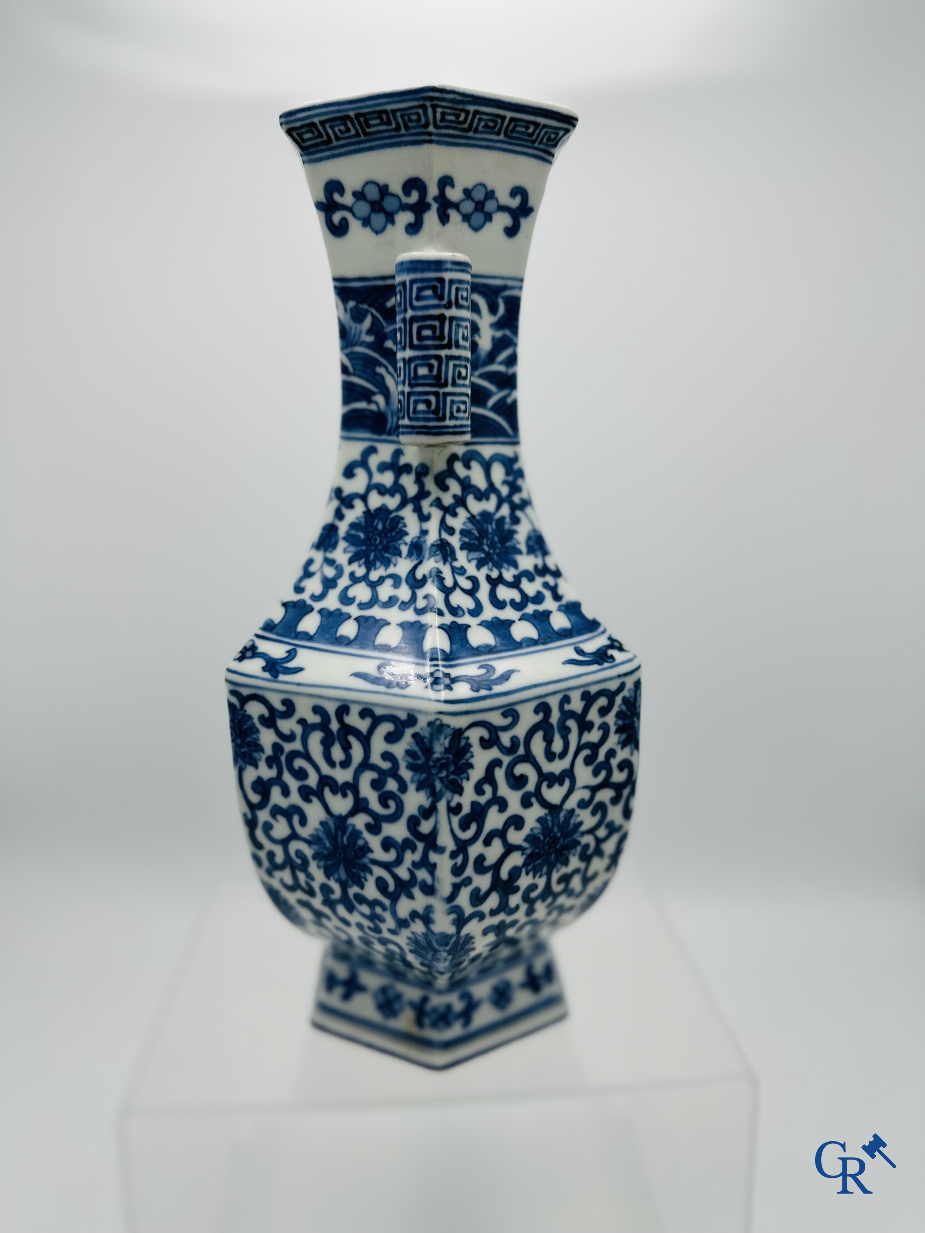 Chinese porcelain: Chinese blue and white vase with floral decor.