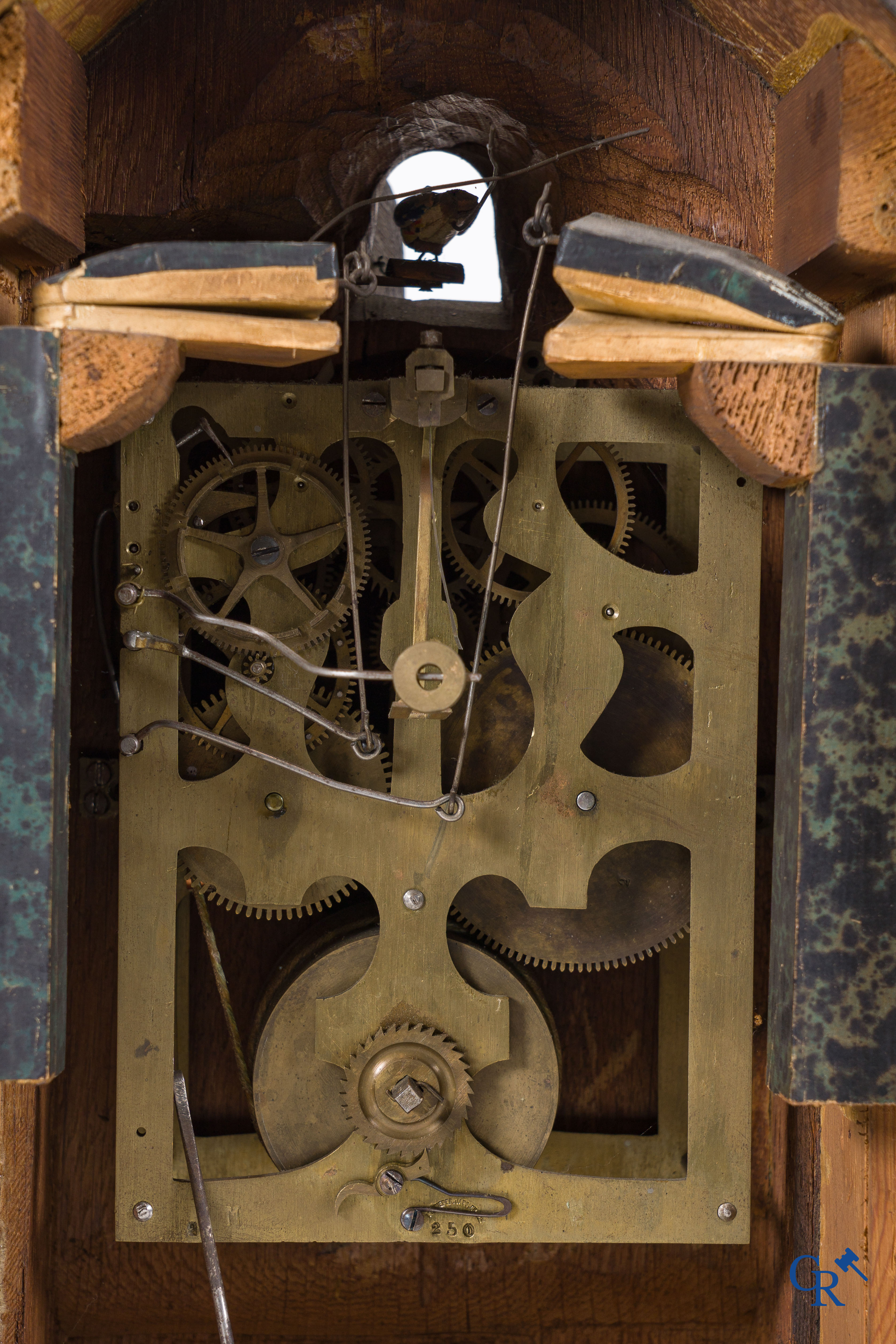 Black Forest, circa 1900. A large 3-piece cuckoo clock in sculpted wood.