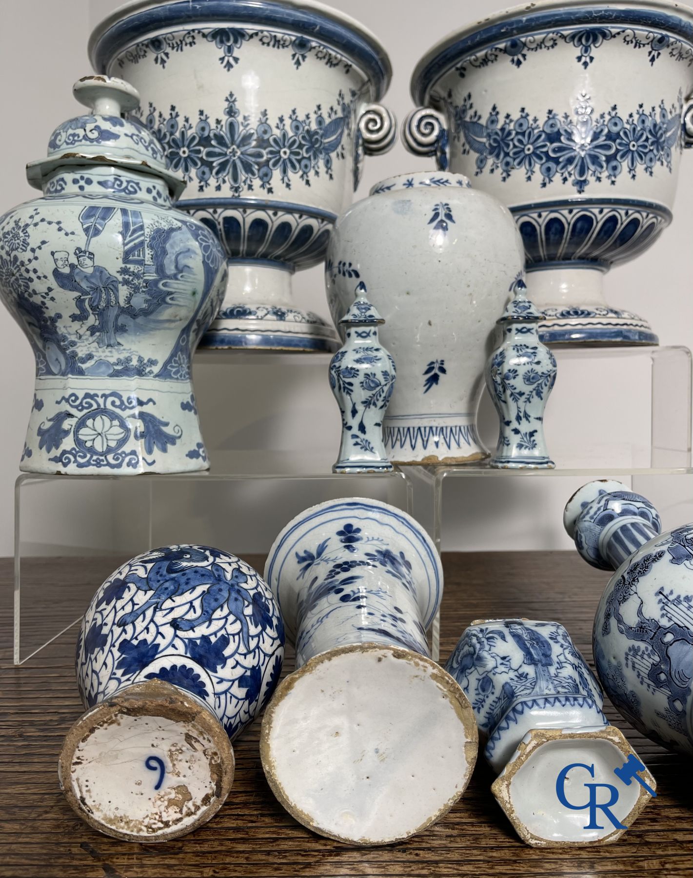 Delft: 11 pieces of blue and white faience with different décors. 17th - 18th century.