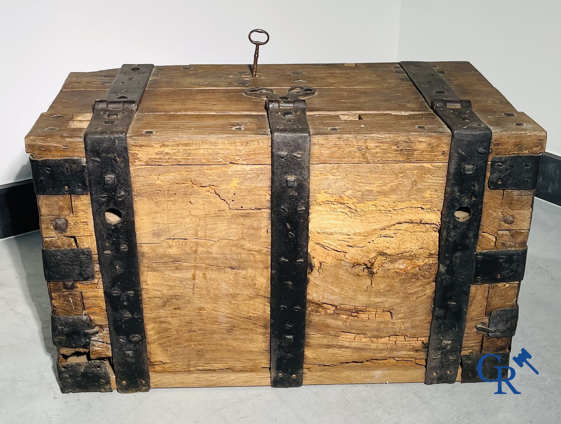 Antique wooden chest with hardware and lockwork in forging.