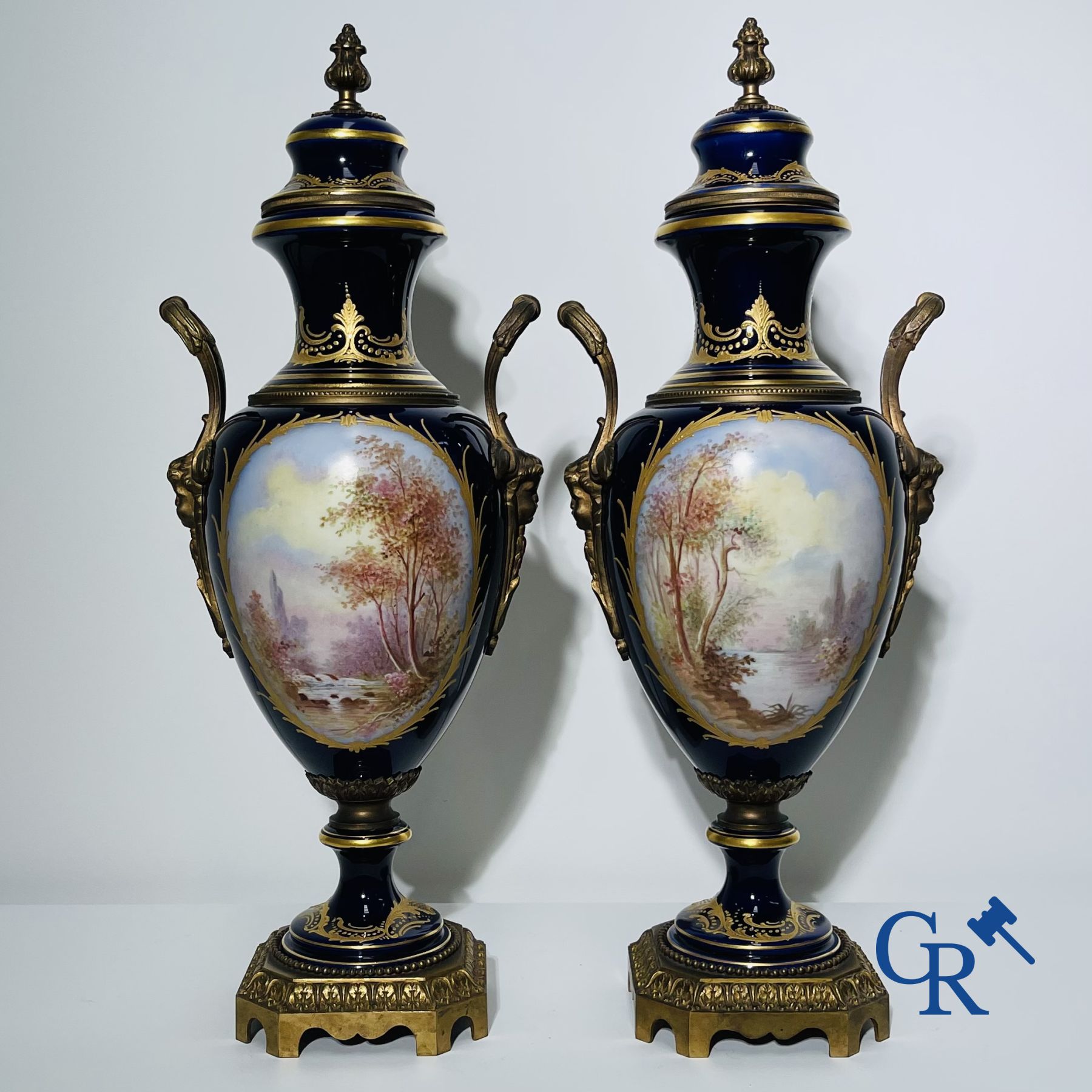 Porcelain: Sèvres: Pair of bronze mounted vases in Sèvres porcelain..