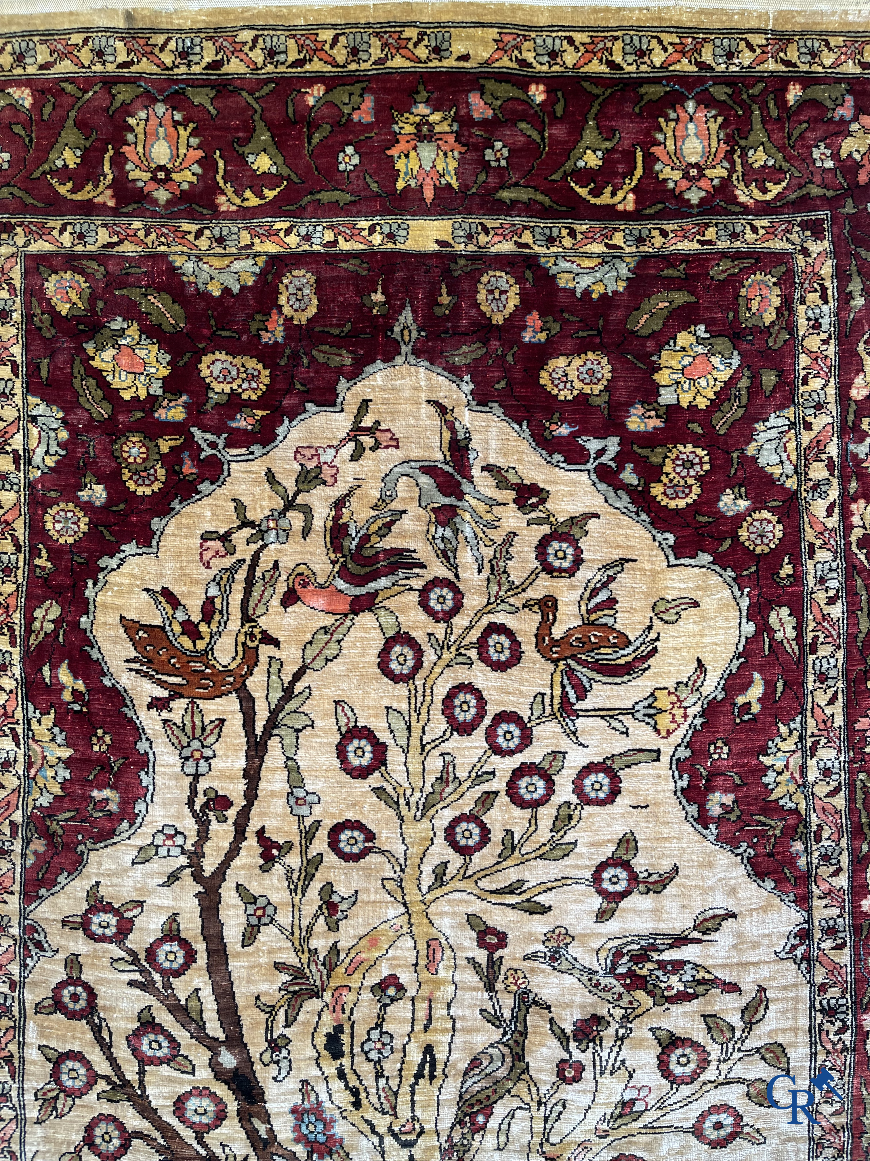 Oriental carpets, Hereke, a finely hand-knotted and signed silk carpet with a tree of life.