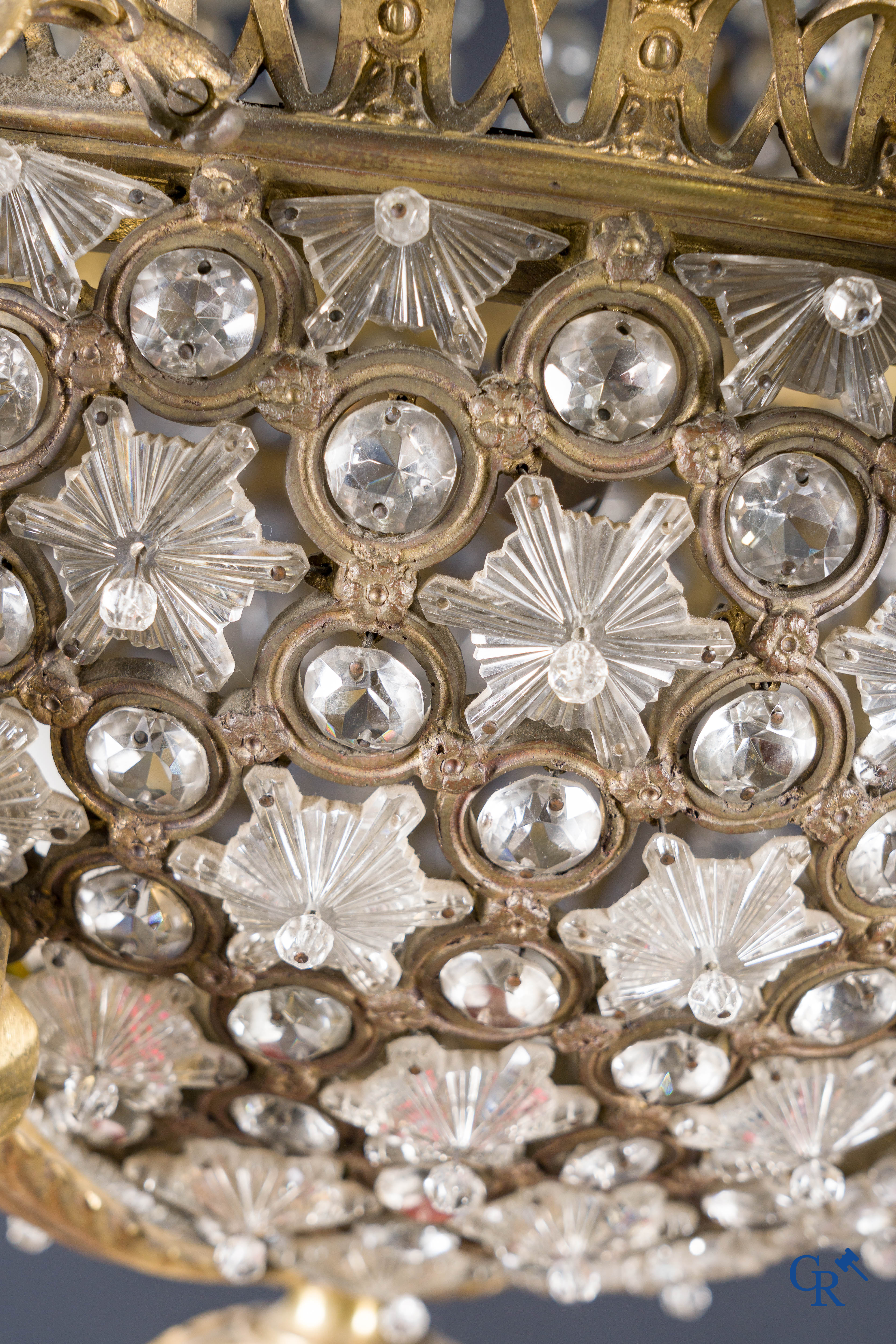 An imposing bronze and crystal chandelier in LXVI style. Circa 1920.