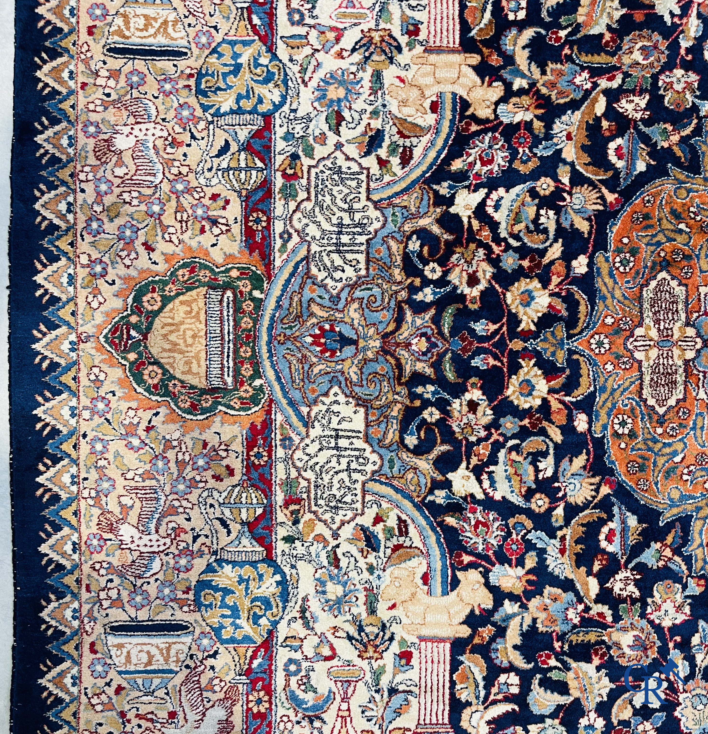 Oriental carpets: A large hand-knotted oriental carpet with antique decor. Multiple inscriptions.