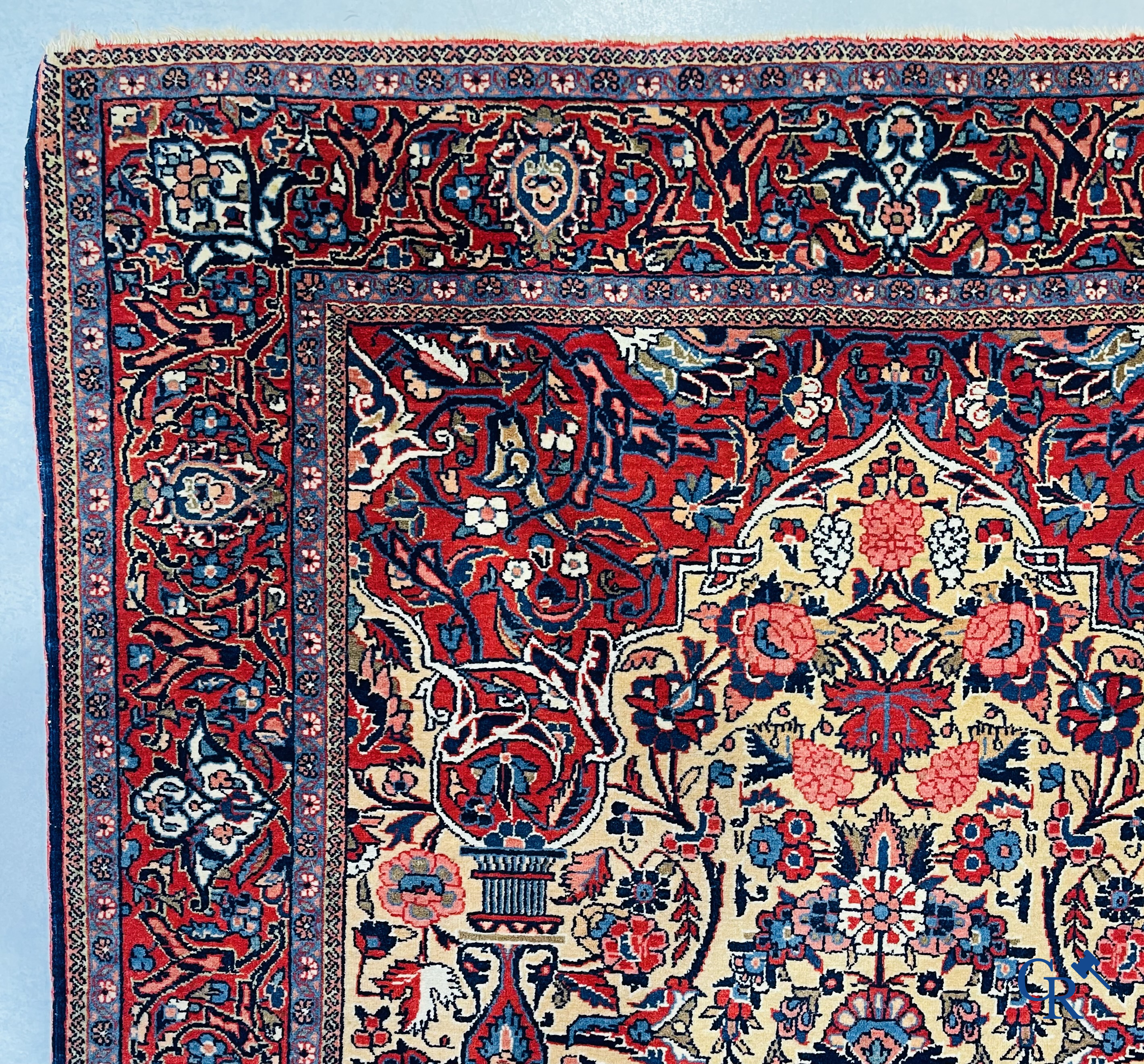 Oriental carpets: Iran. 2 antique hand-knotted Persian carpets with floral decor.