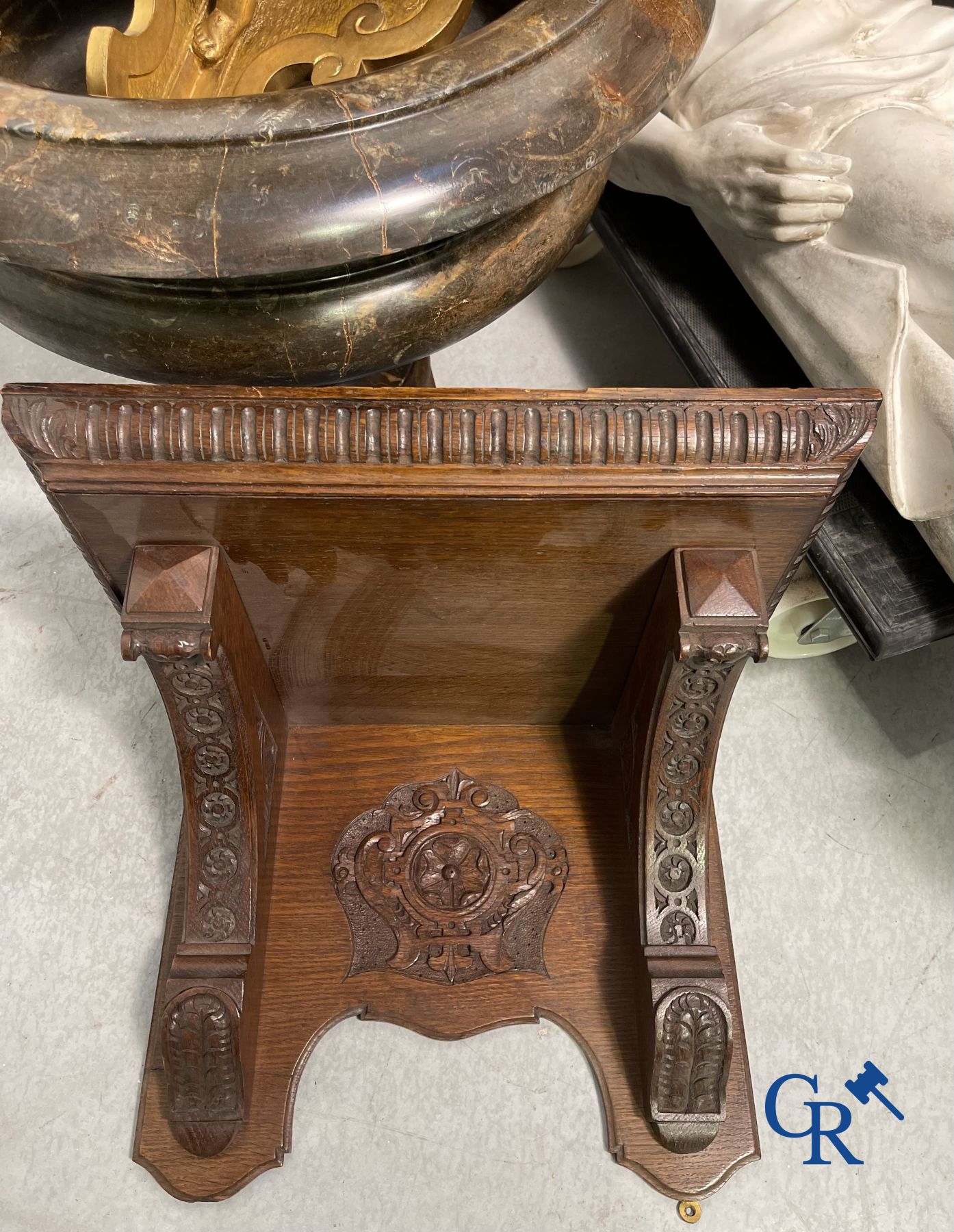 Clock with multiple bells and music in oak sculpted case with matching pedestal.