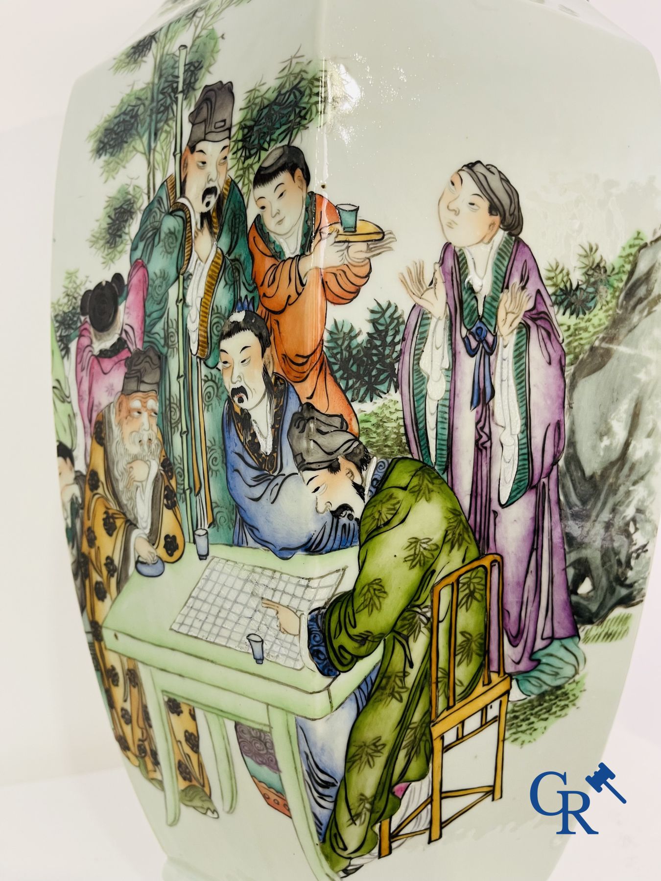 Asian Art: Chinese porcelain. A hexagonal Chinese Famille rose vase with sages and scholars. 19/20th century.