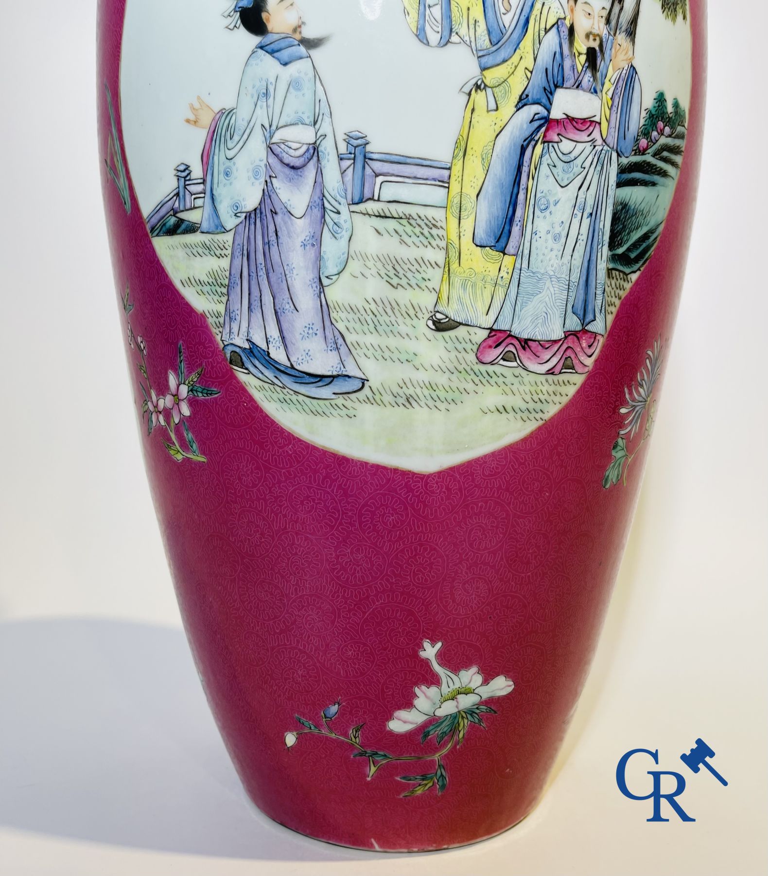 Chinese porcelain: A fine famille rose vase decorated on a red ruby background in sgraffito technique.