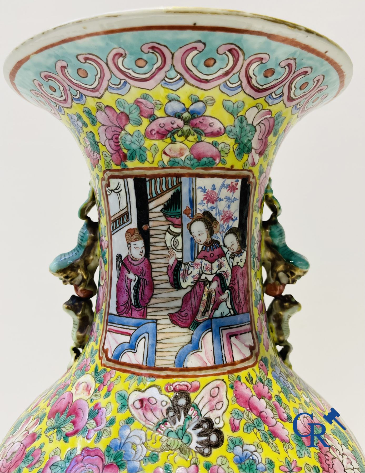 Asian art: A pair of Chinese famille rose vases with yellow background with court scenes. 19th century.