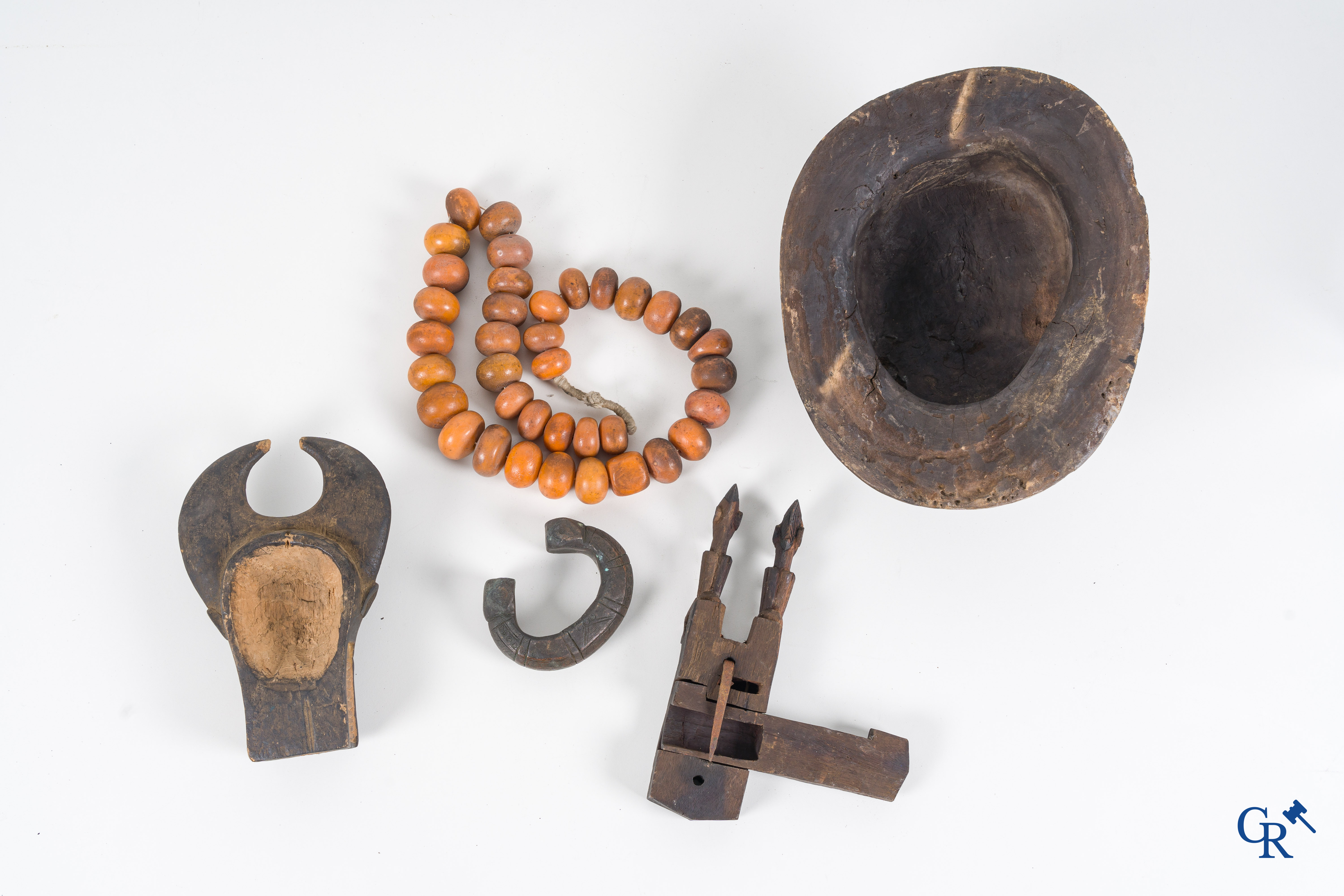 Tribal art, Primitive art. A lot with African objects, masks, bronze slave band, necklace and others.