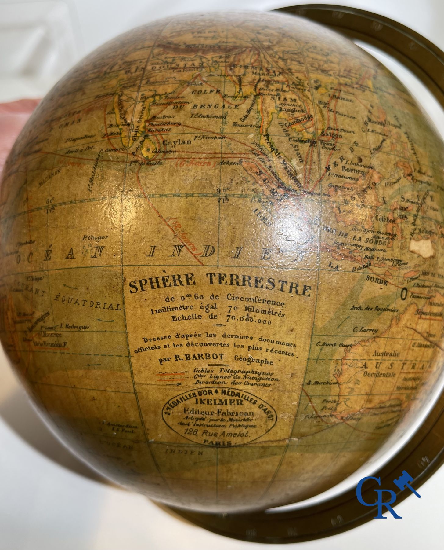 An antique globe with meridian circle on a black lacquered wooden base. 19th century.