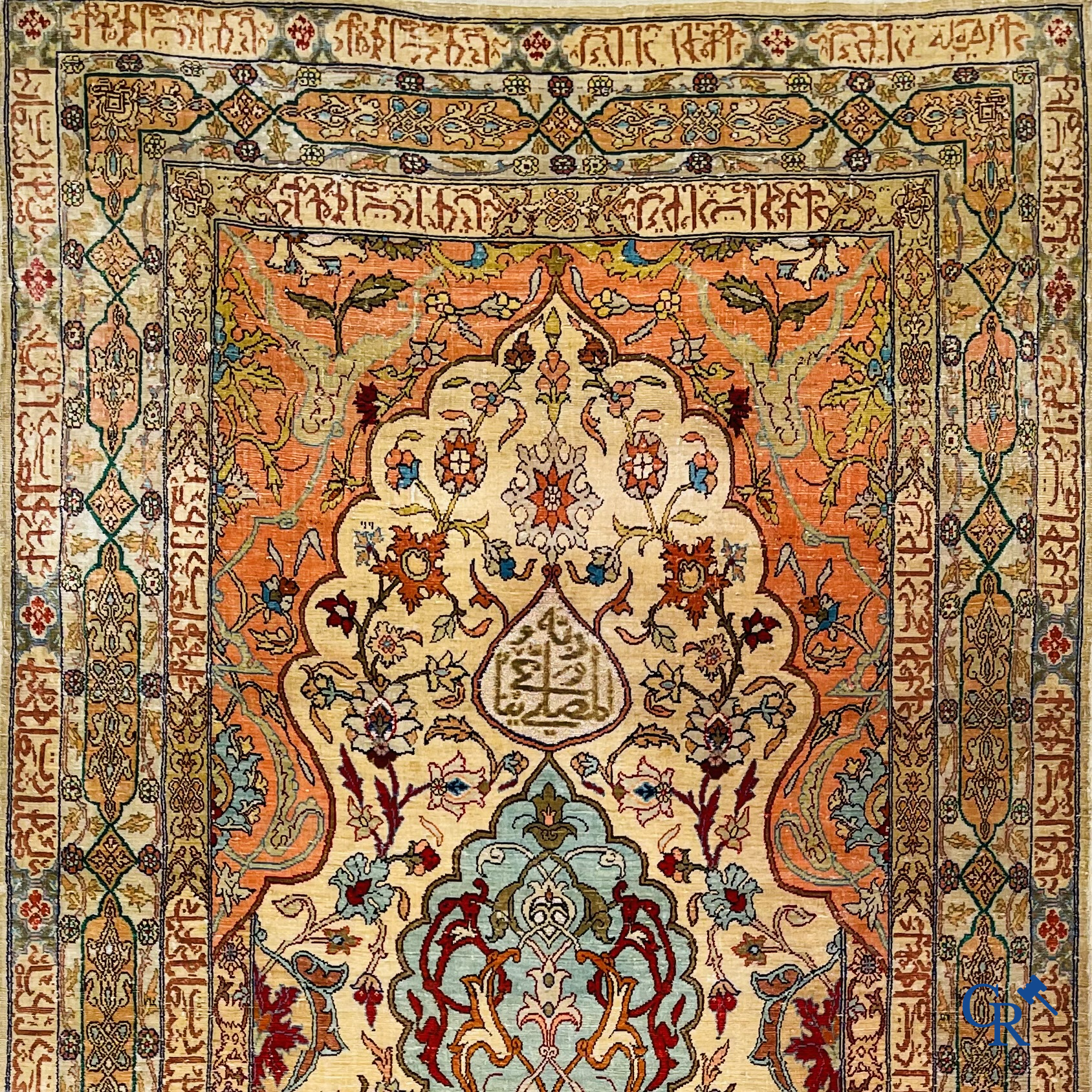 Oriental carpets, Hereke Turkey, a finely hand-knotted silk carpet with inscriptions and gold thread.