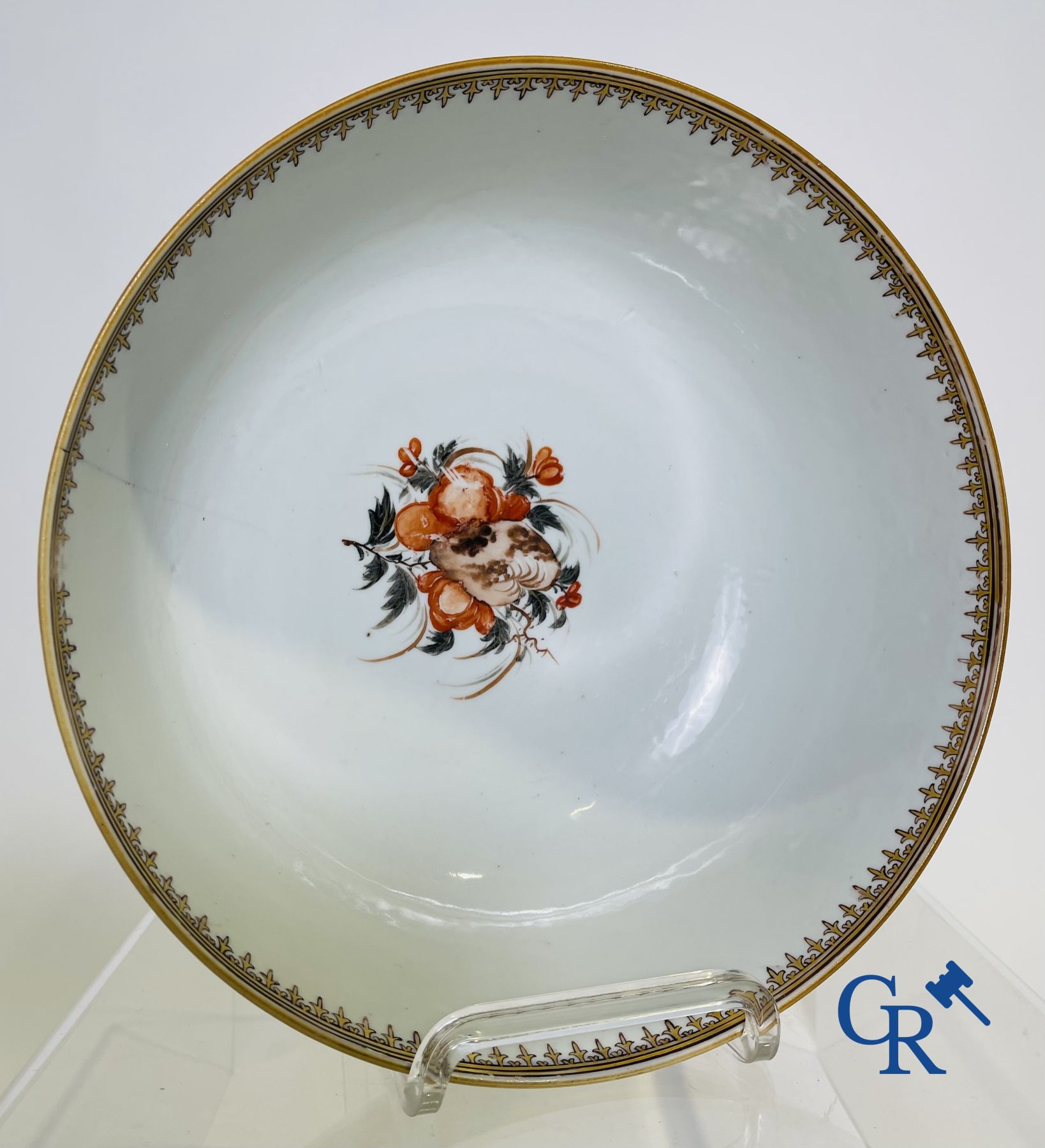 A large Chinese famille rose mandarin bowl, a famille rose cup and saucer and a figurine in blanc de chine.