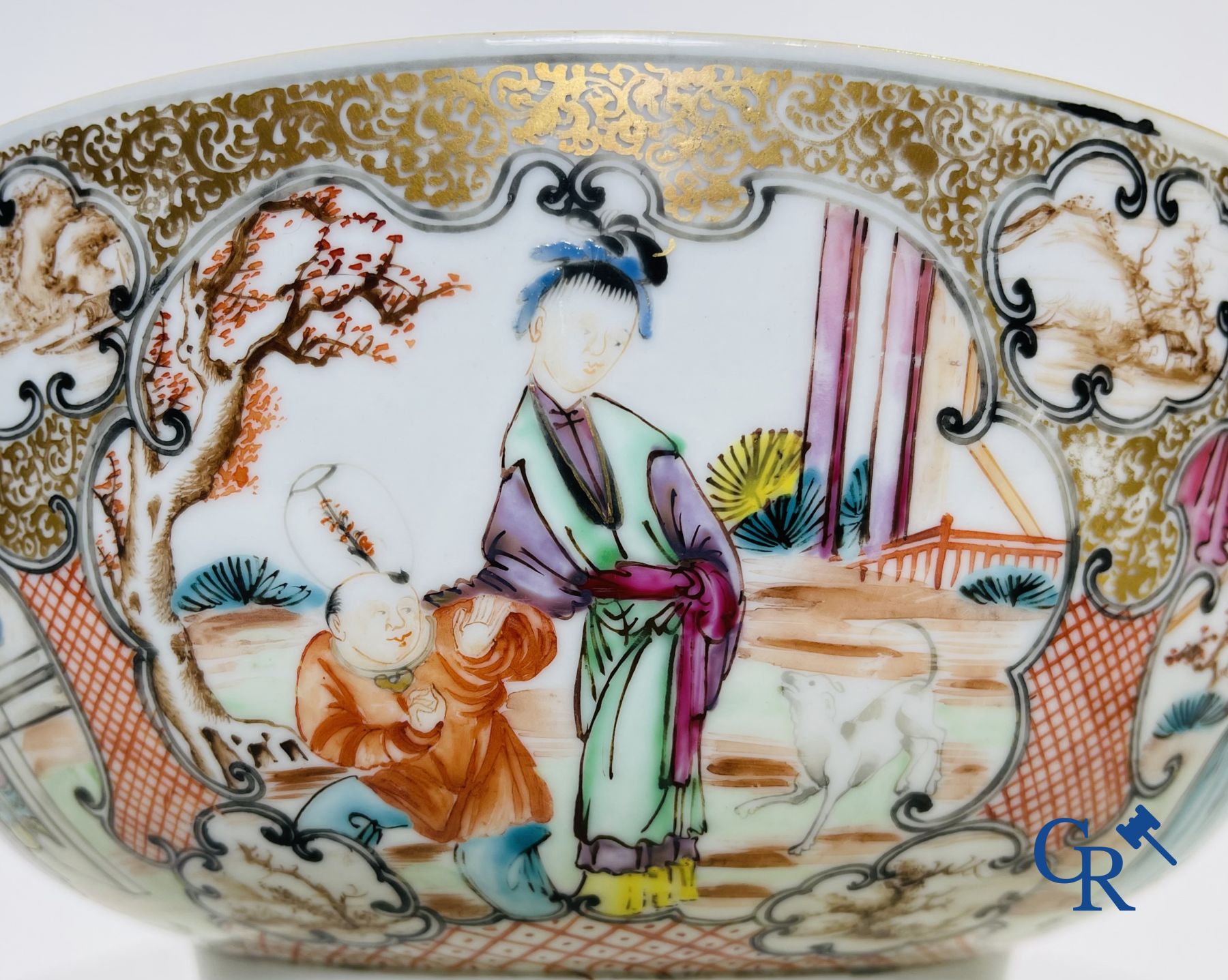 Un grand bol chinois decor mandarin en famille rose, une tasse et soucoupe en famille rose et une figurine en blanc de chine.