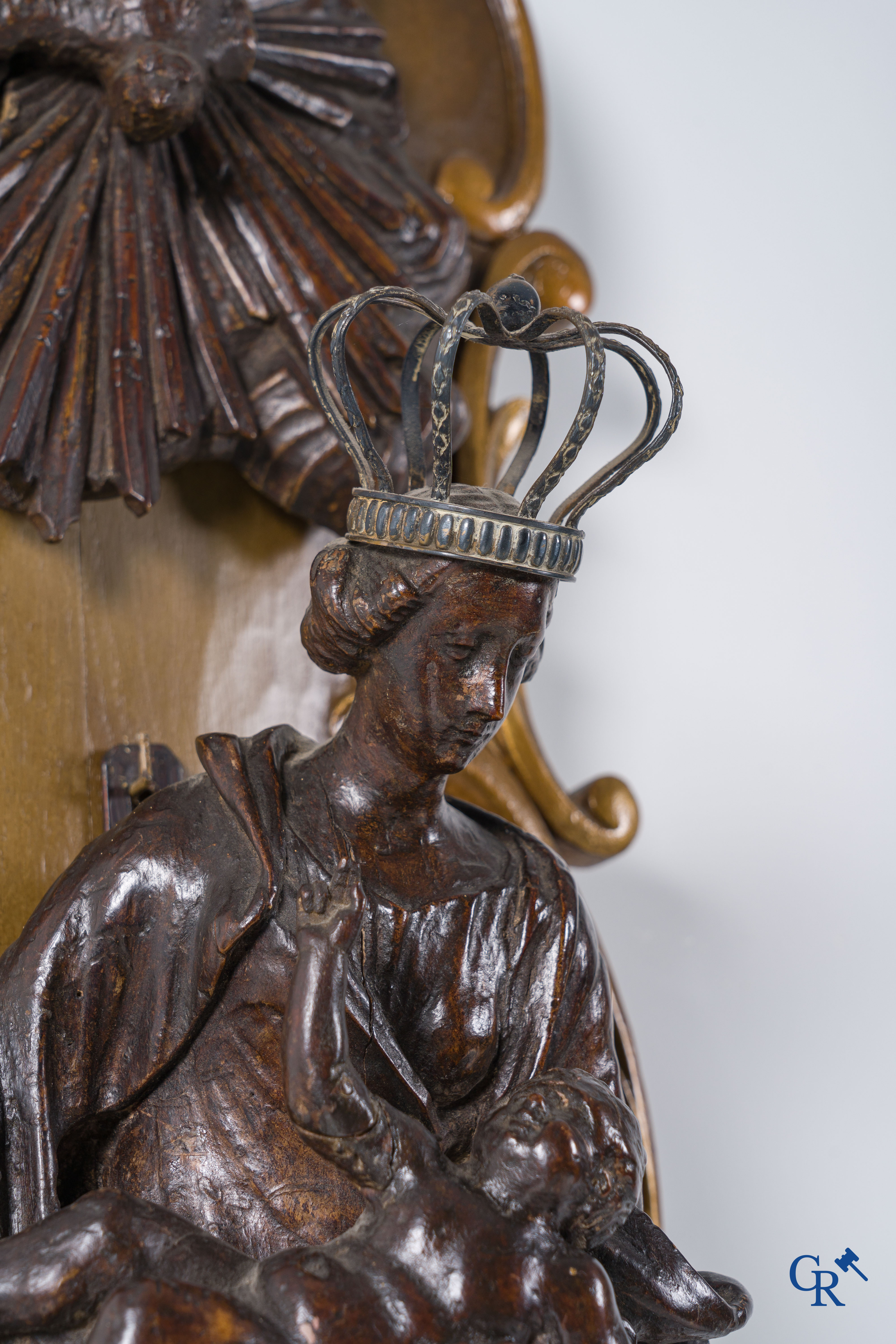 Imposing wooden sculpture of Mary with child, richly sculpted with angels and a dragon. 17th-18th century.