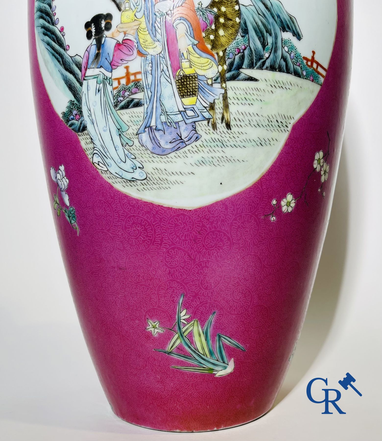 Chinese porcelain: A fine famille rose vase decorated on a red ruby background in sgraffito technique.