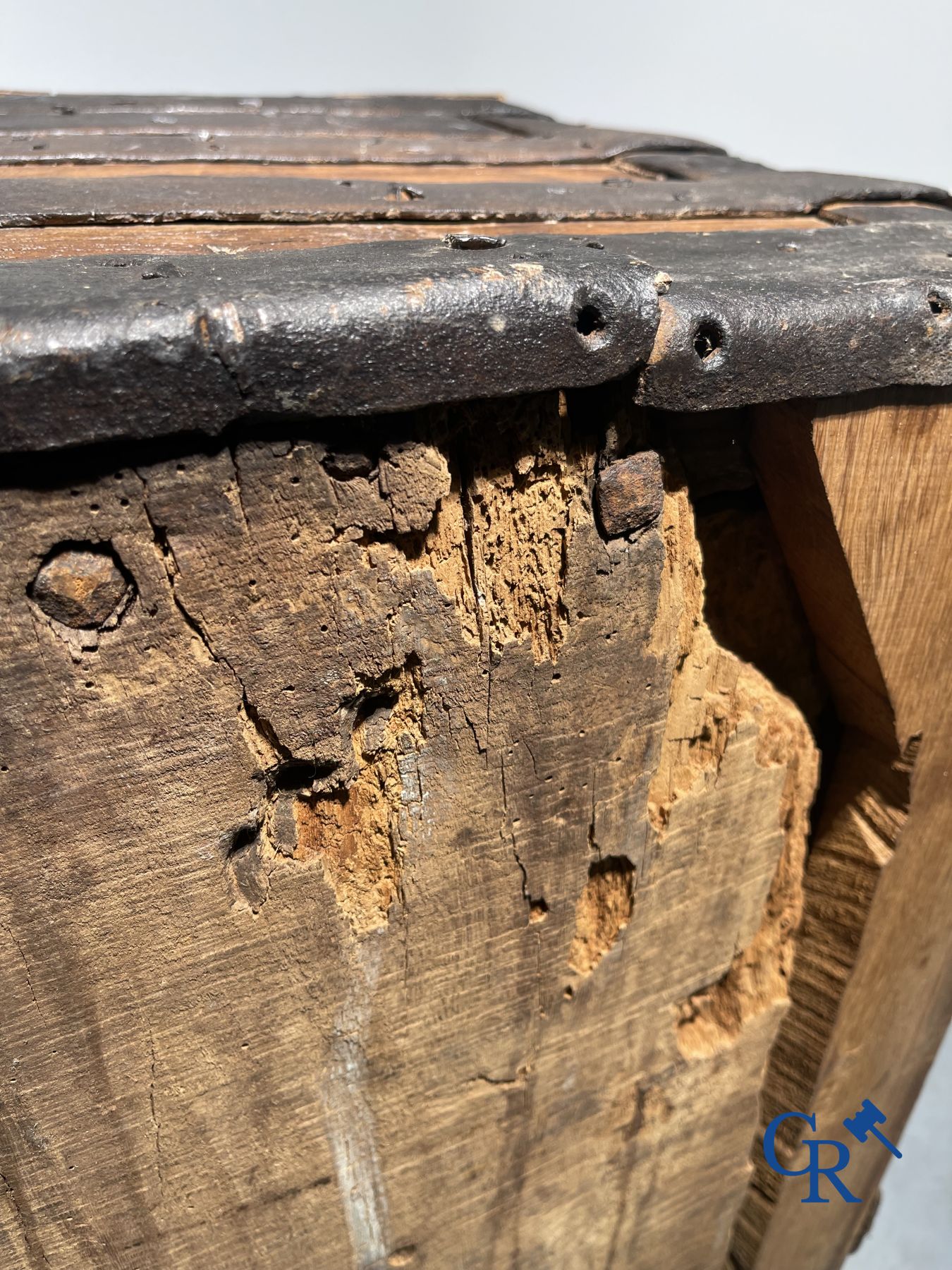 Antique wooden chest with hardware and lockwork in forging.