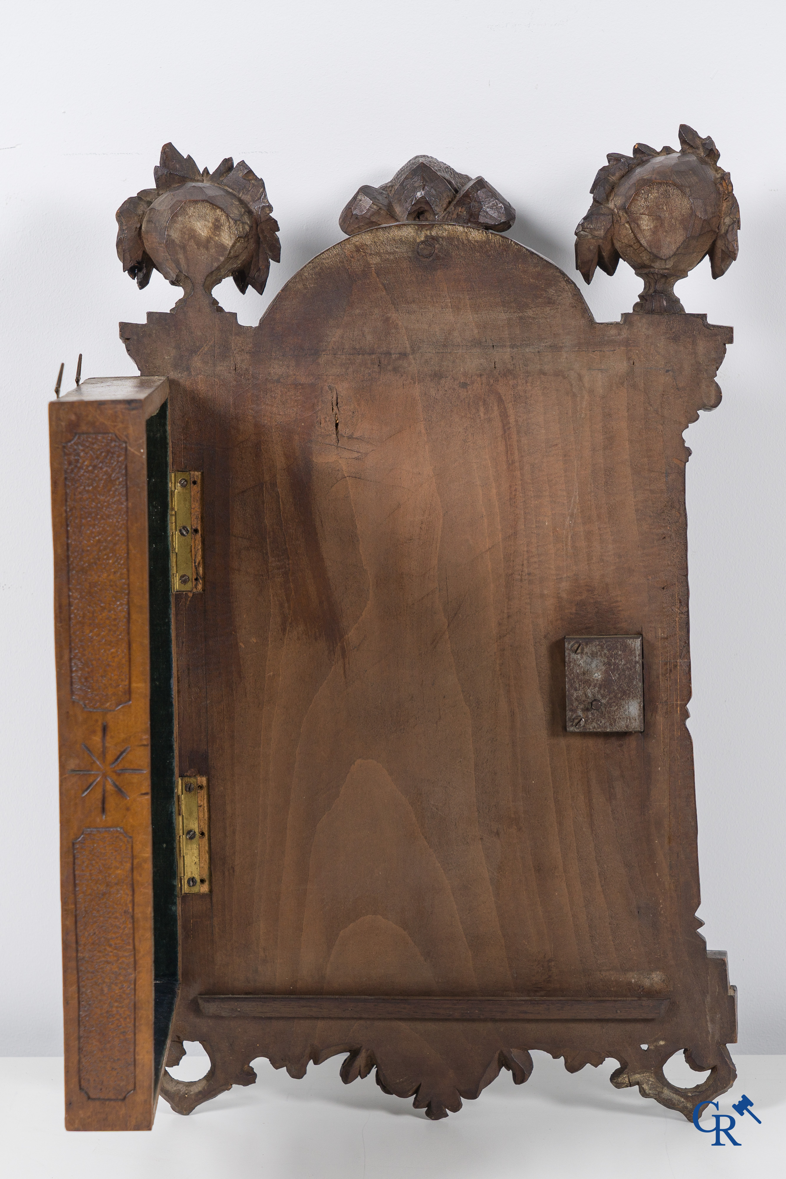 Black forest carvings. Key cabinet in richly sculpted wood with hunting scenes. Circa 1880.