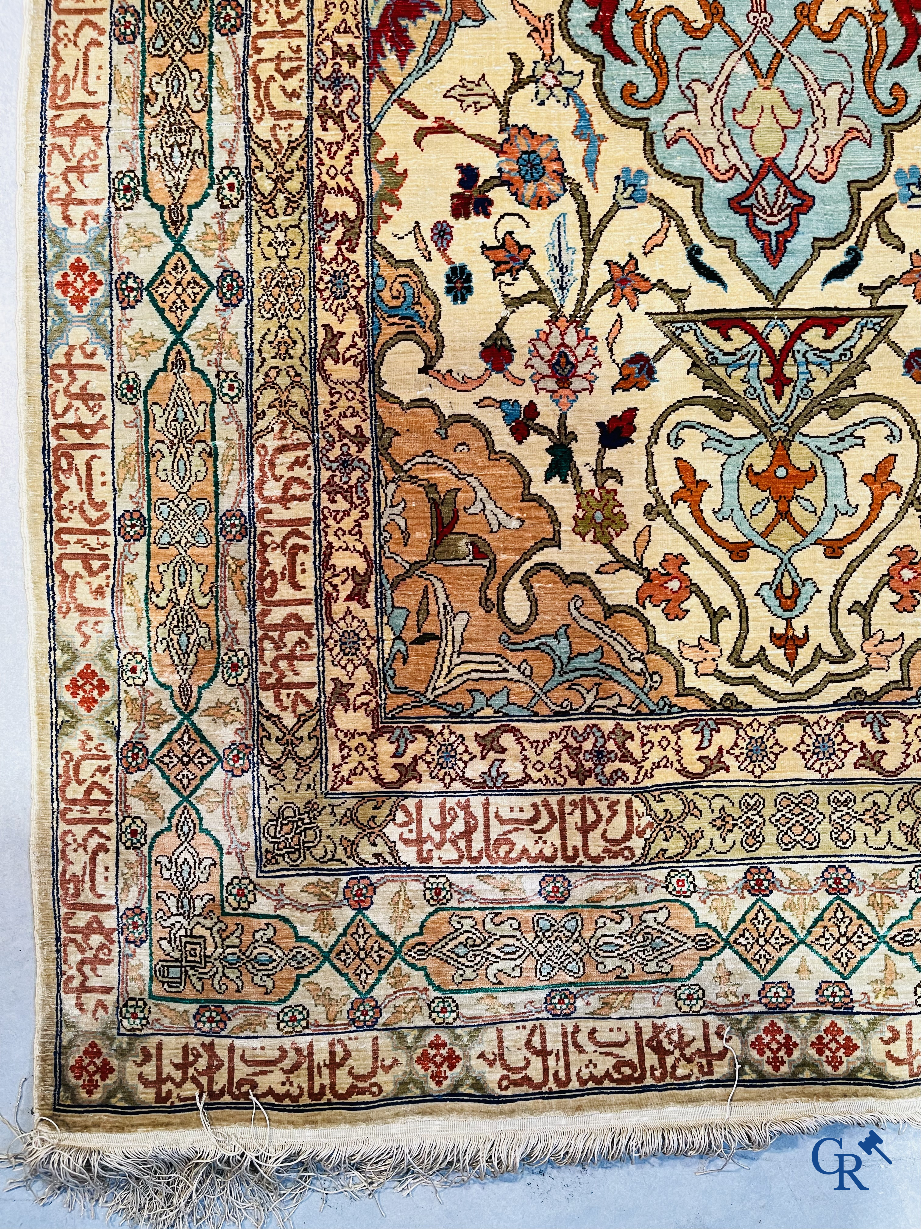 Oriental carpets, Hereke Turkey, a finely hand-knotted silk carpet with inscriptions and gold thread.