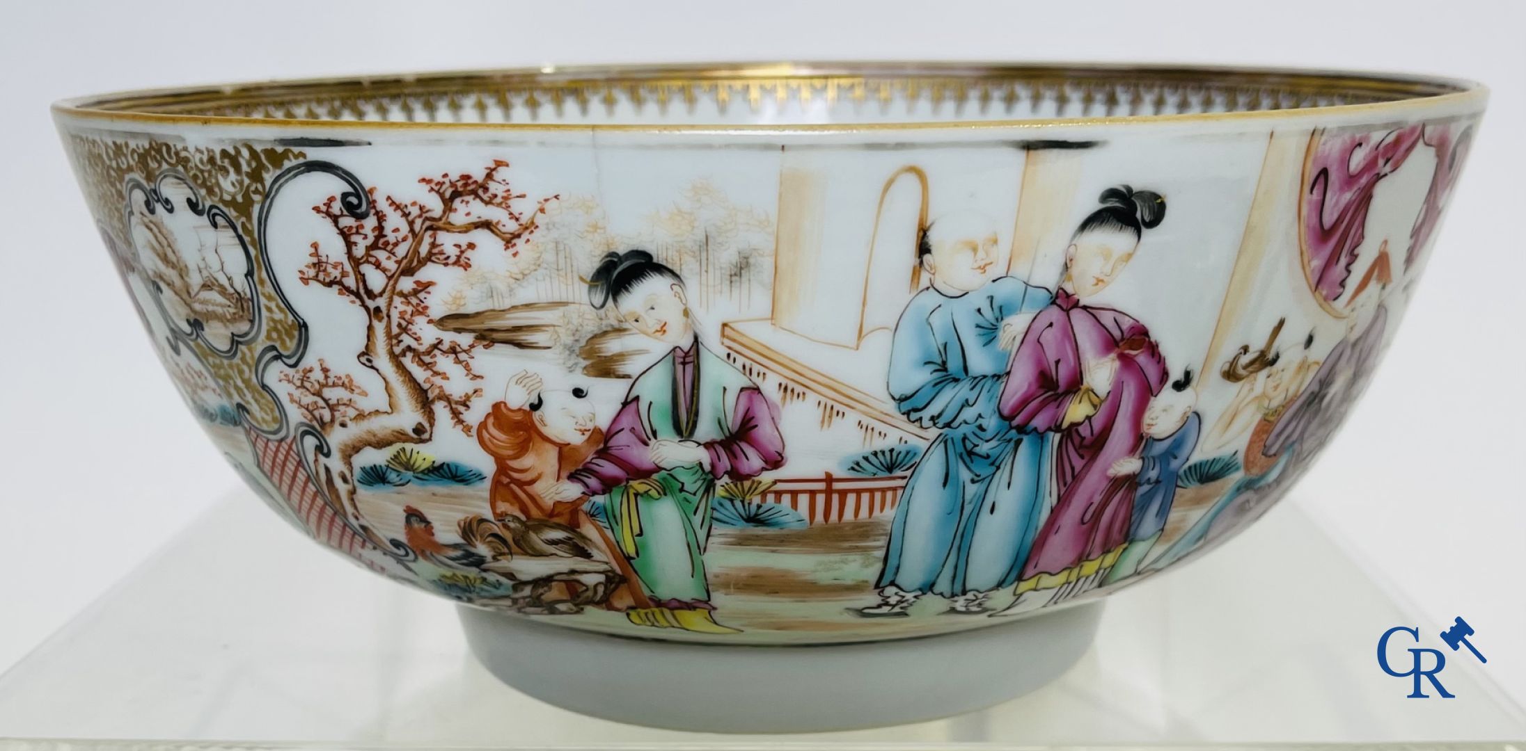 Un grand bol chinois decor mandarin en famille rose, une tasse et soucoupe en famille rose et une figurine en blanc de chine.